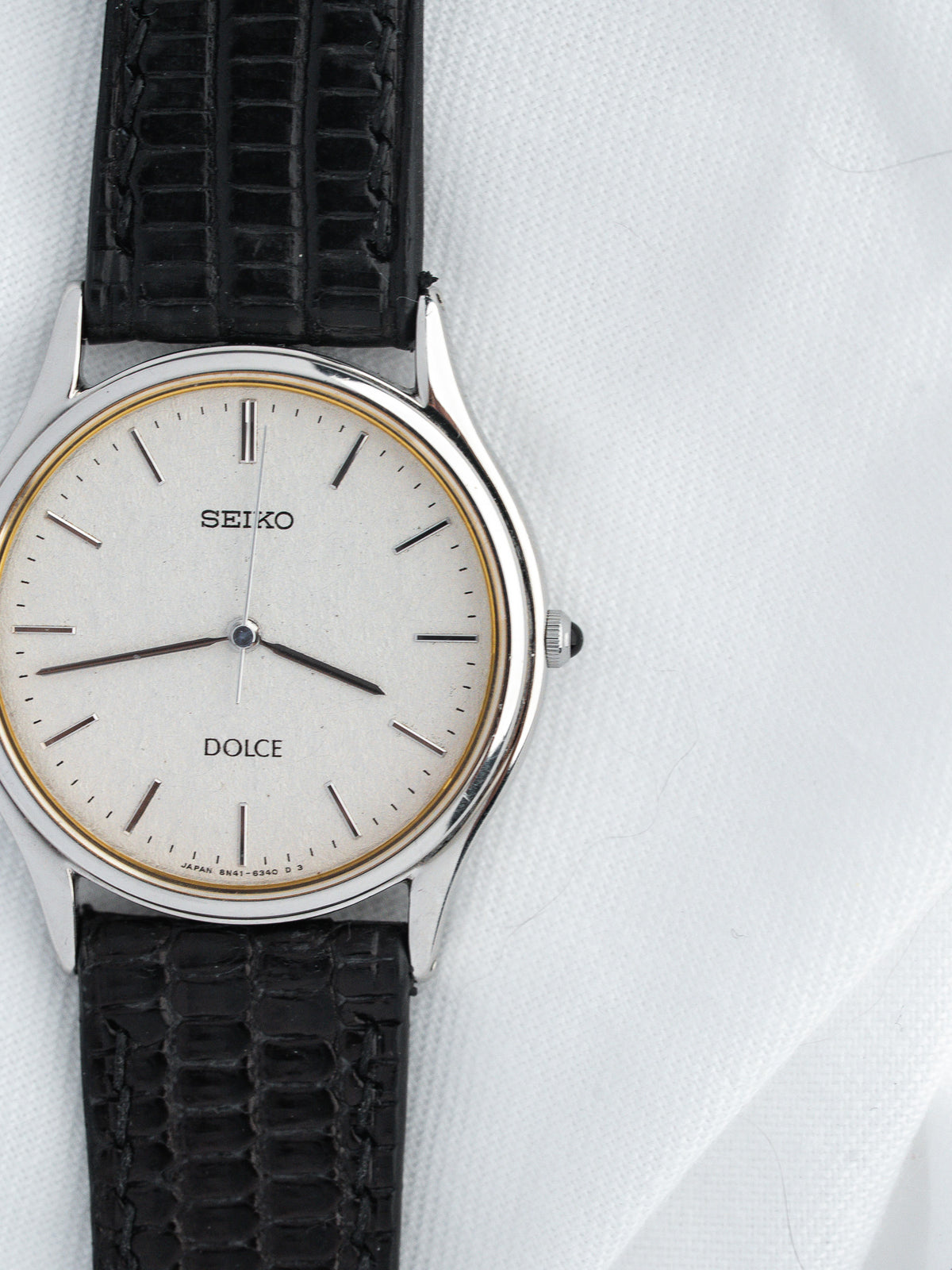Seiko Dolce vintage watch with silver dial and black textured strap