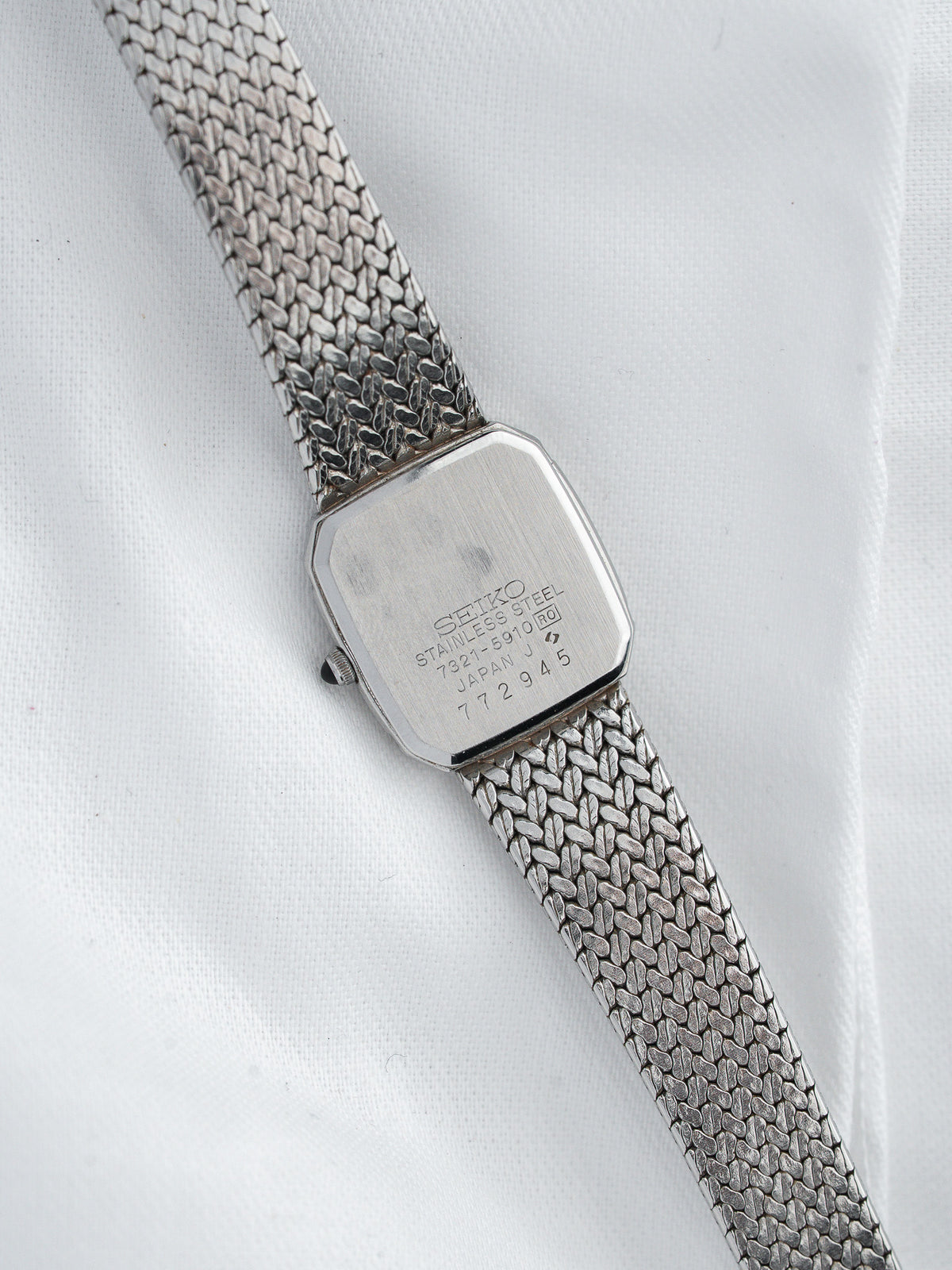 Seiko vintage watch with stainless steel mesh bracelet and engraved case back
