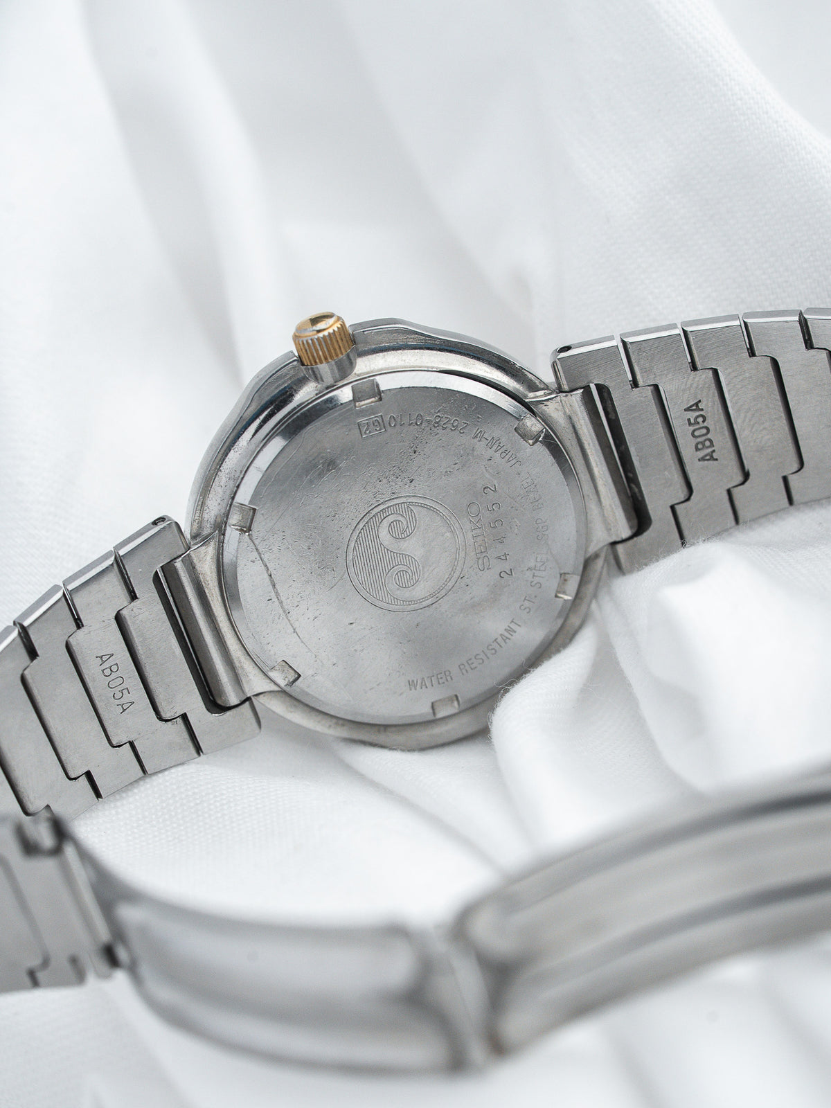 Seiko vintage watch back with engraved logo, stainless steel case and bracelet
