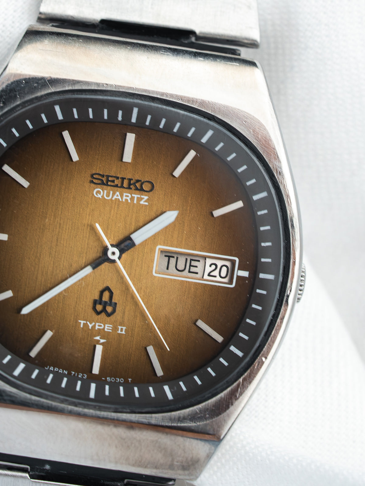 Seiko Quartz Type II vintage watch with brown dial, day-date window, and steel bracelet