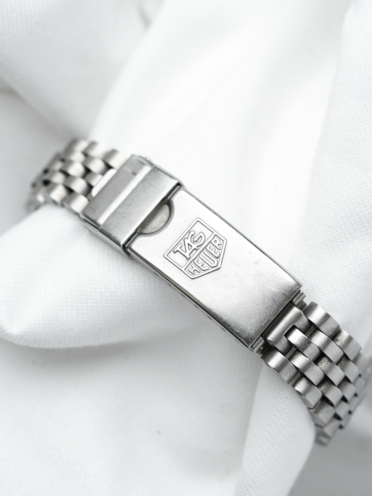 TAG Heuer vintage steel bracelet with engraved logo on clasp
