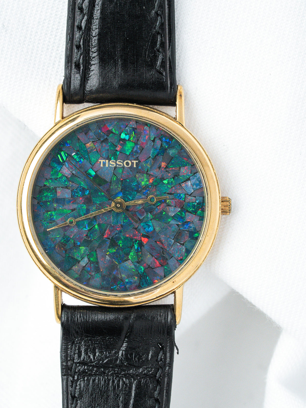 Tissot vintage watch with opal mosaic dial, gold case, black leather strap