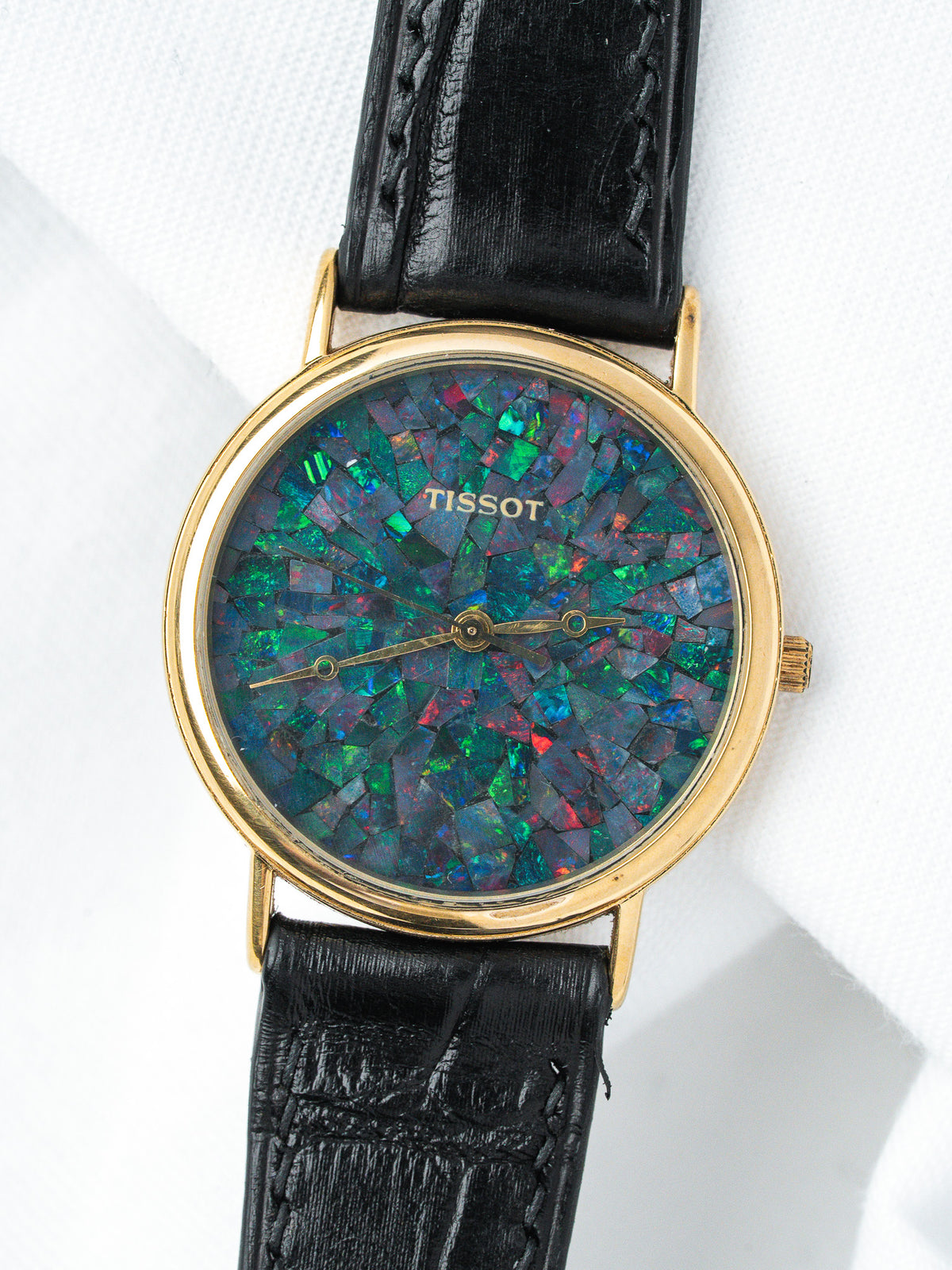 Tissot vintage watch with opal mosaic dial, gold case, black leather strap