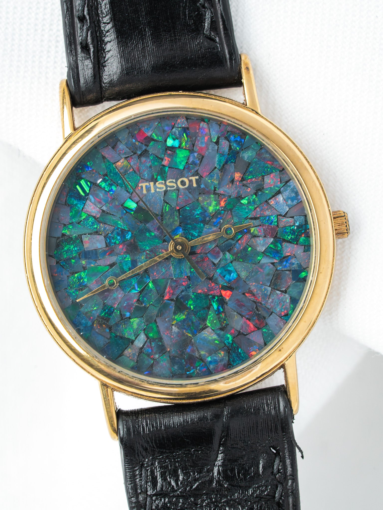 Tissot vintage watch with opal mosaic dial, gold case, black leather strap