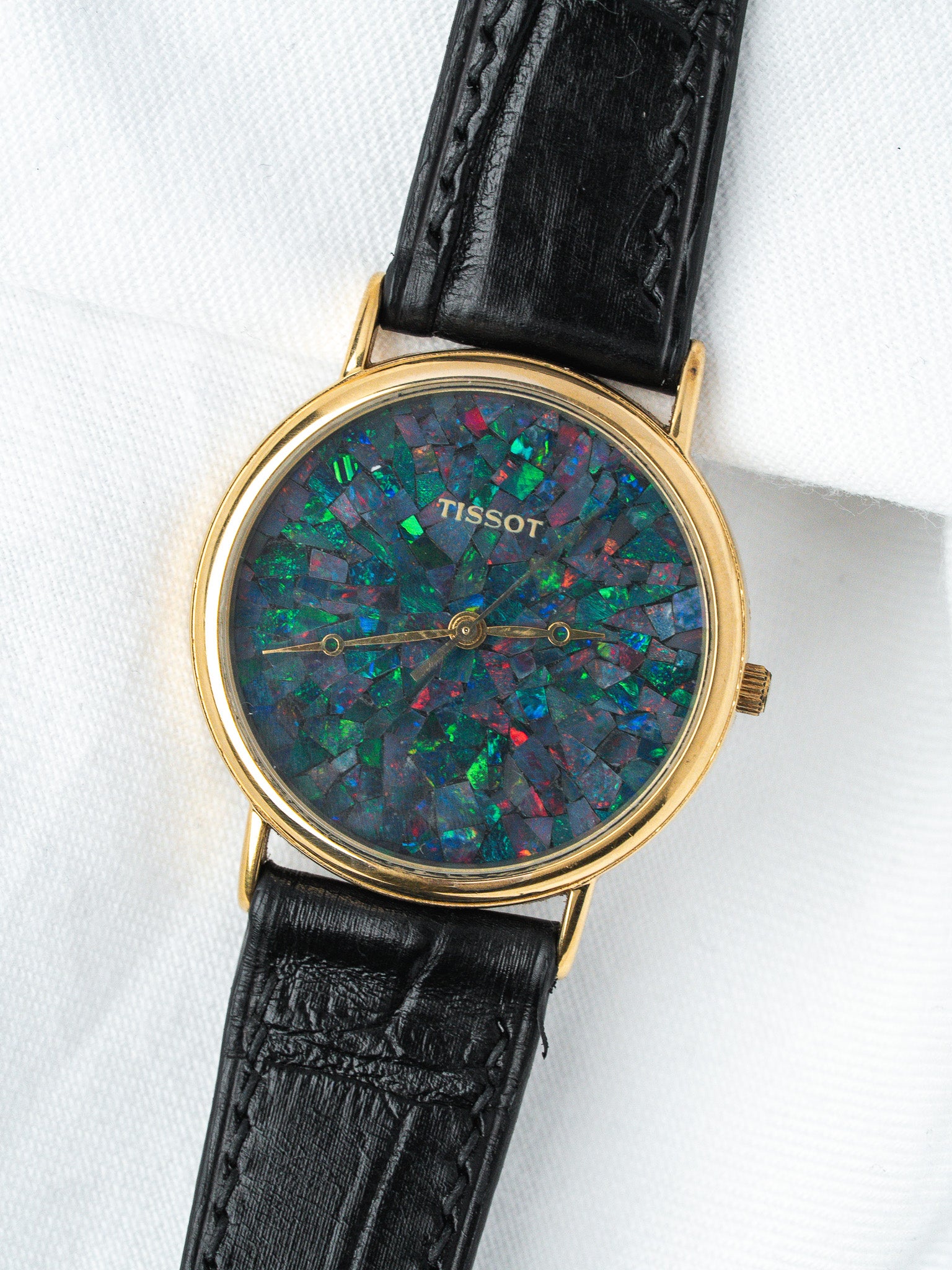 Tissot vintage watch with opal mosaic dial, gold case, black leather strap