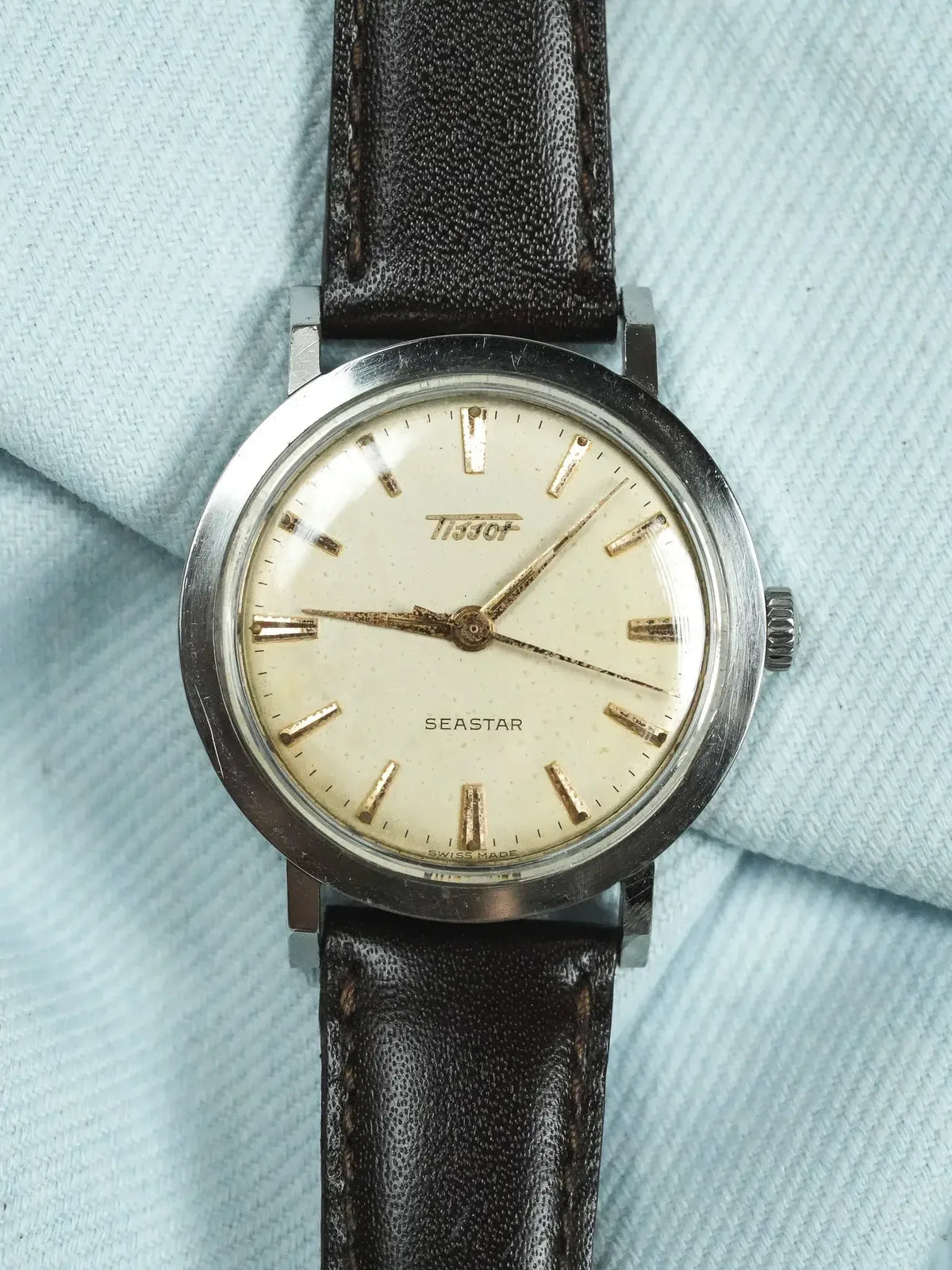 Tissot Seastar vintage watch with cream dial, gold markers, and brown leather strap