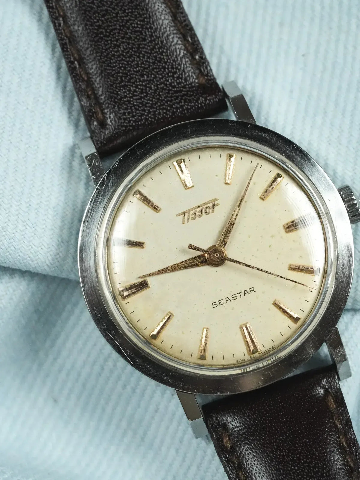 Tissot Seastar vintage watch with cream dial, gold markers, and brown leather strap