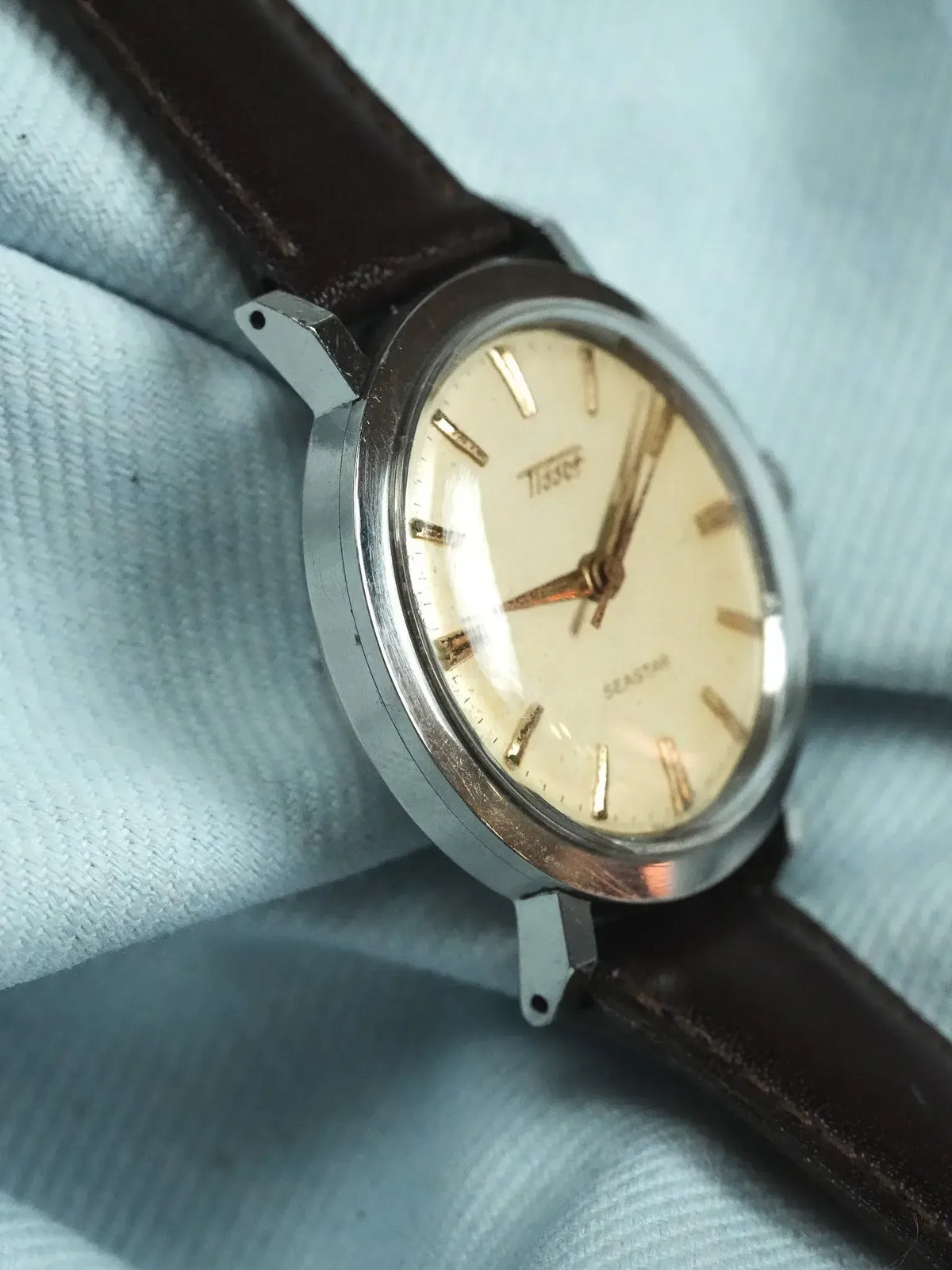 Tissot Seastar vintage watch with cream dial, gold markers, steel case, brown leather strap