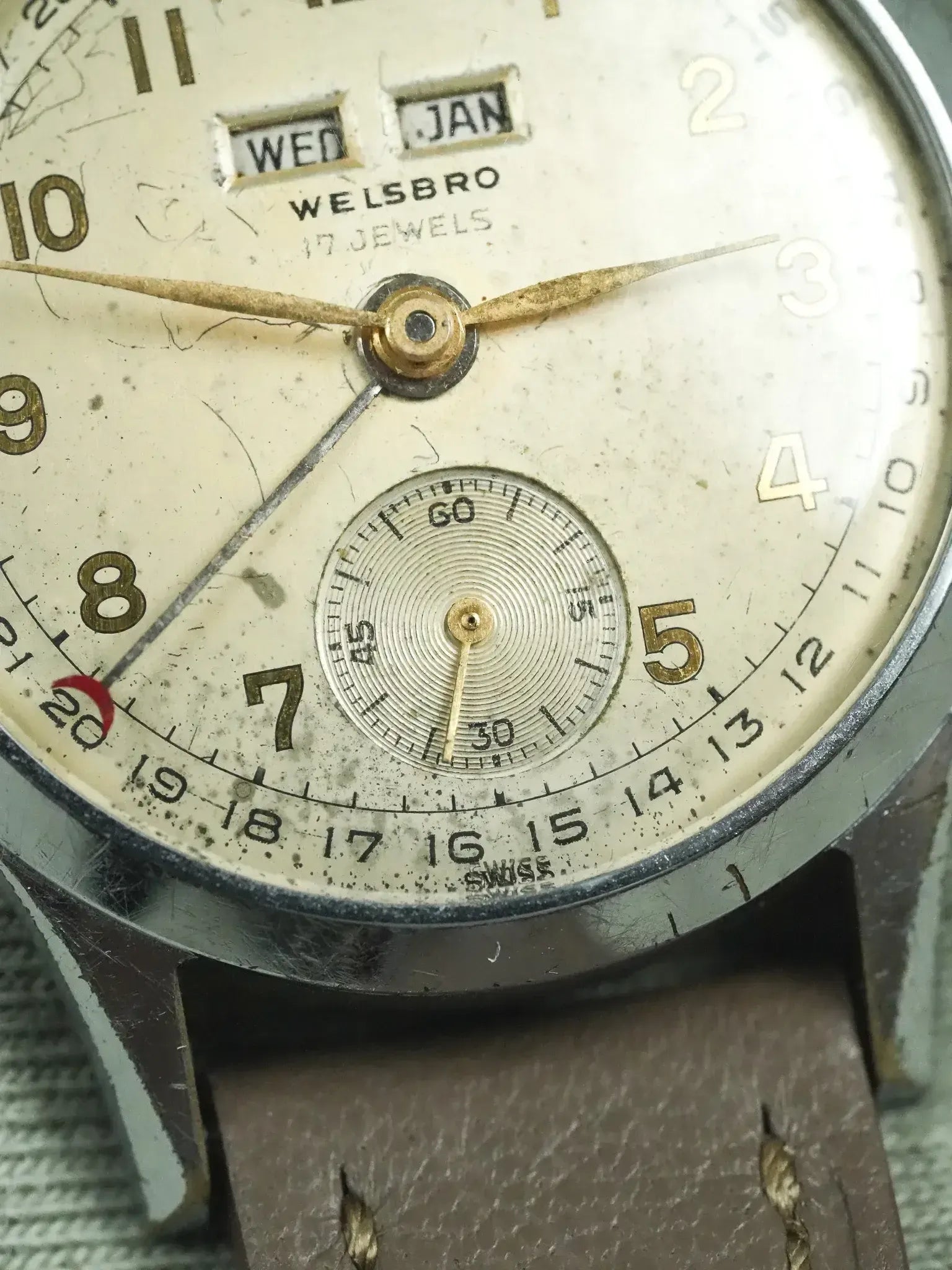 Welsbro vintage watch with cream dial, day-date window, and brown leather strap