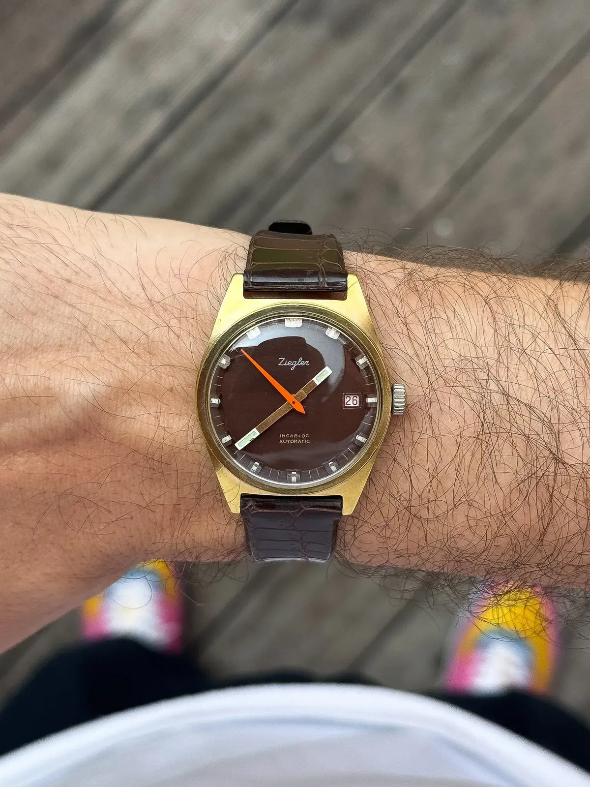 Ziegler vintage watch with brown dial, gold case, and leather strap on wrist