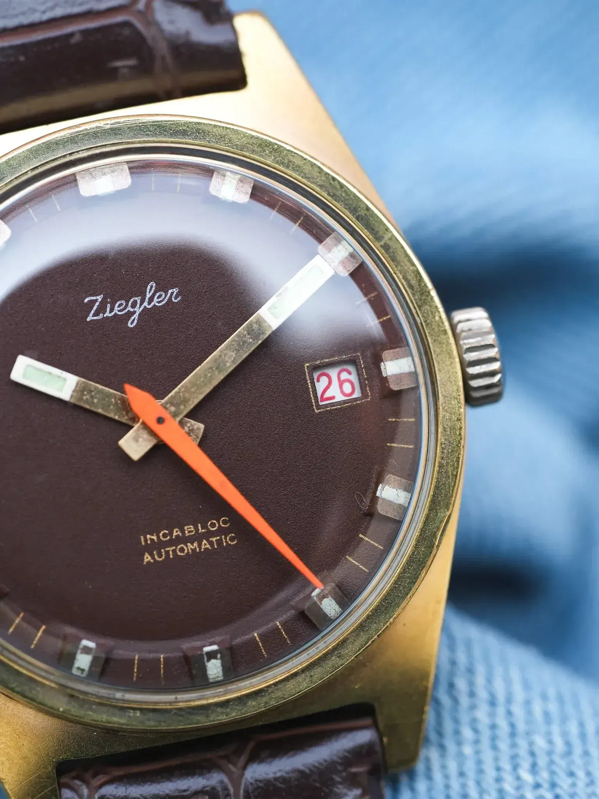 Ziegler vintage automatic watch with brown dial, orange seconds hand, and date window
