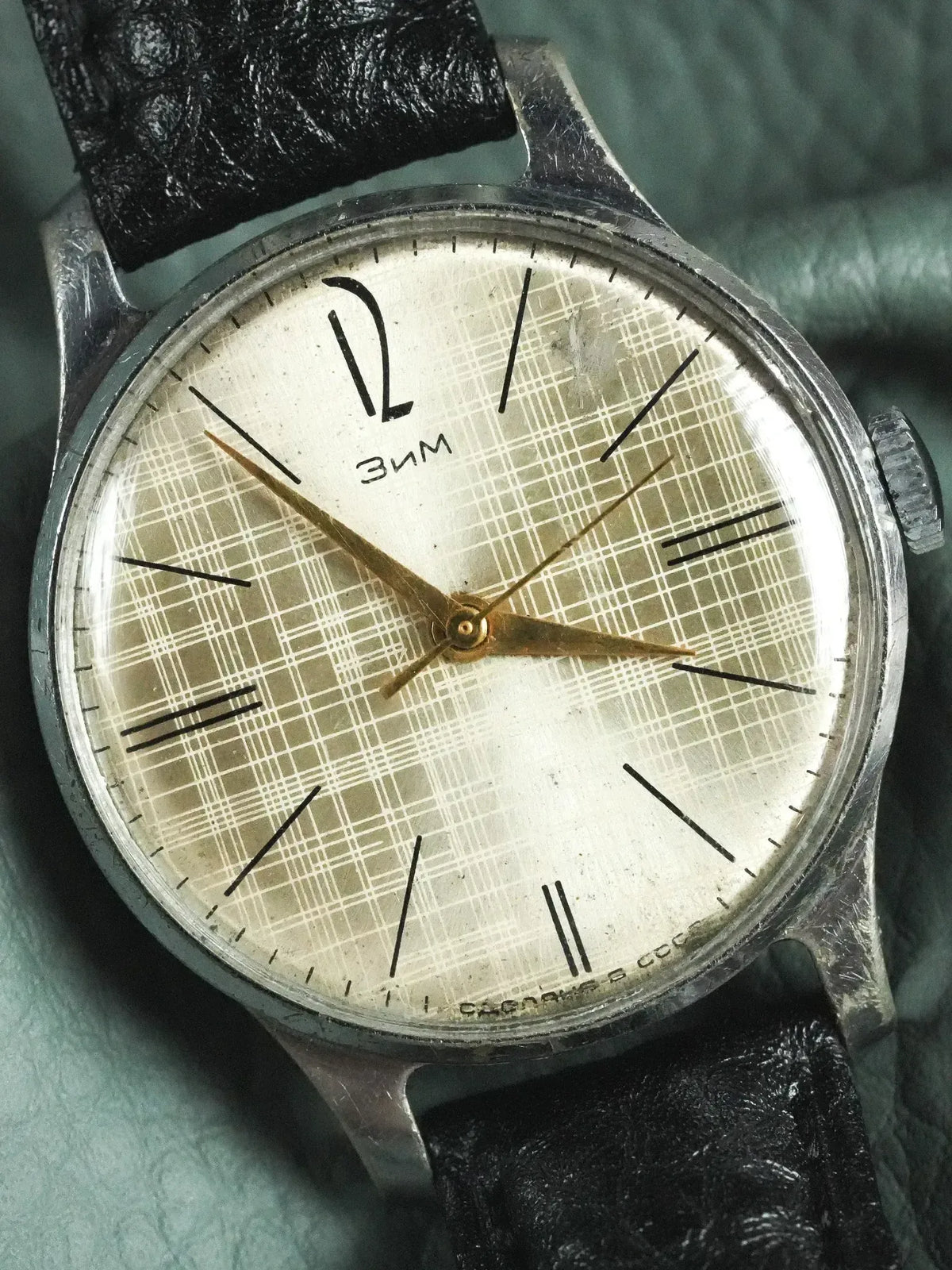 Vintage ZIM watch with silver case, cream plaid dial, black leather strap, USSR marking