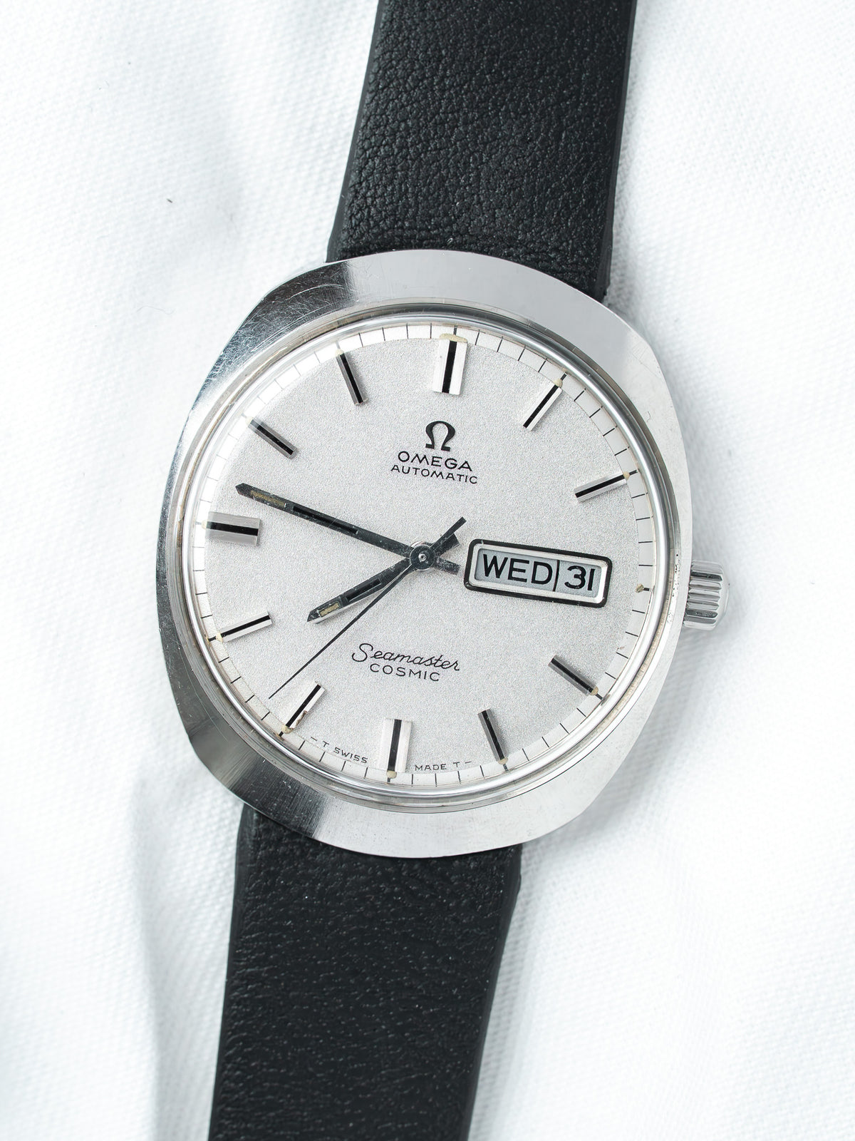 Omega Seamaster Cosmic vintage watch with silver dial and black leather strap