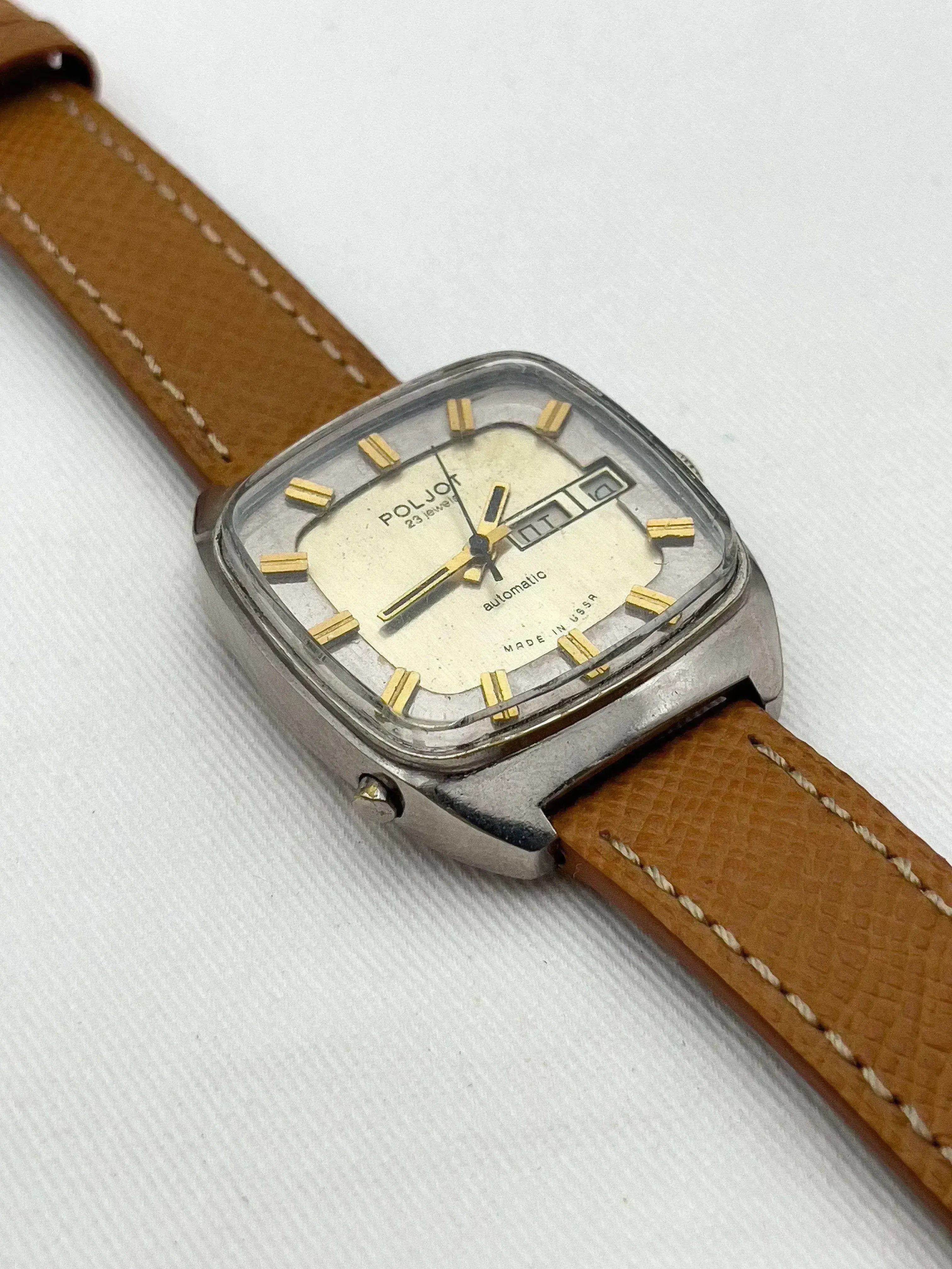 Poljot vintage automatic watch with cream dial, gold markers, and brown leather strap