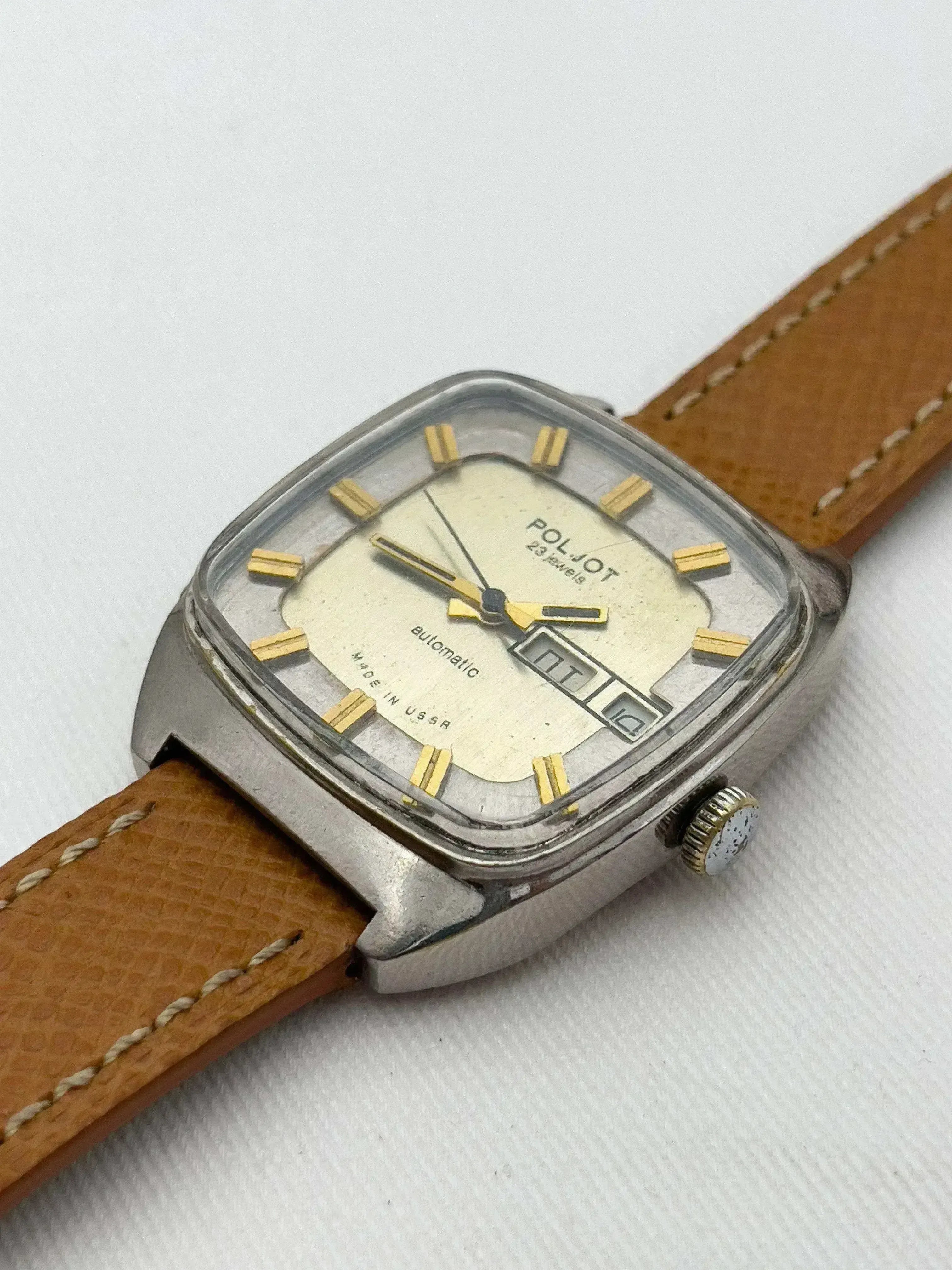 Poljot vintage automatic watch with cream dial, gold markers, and brown leather strap