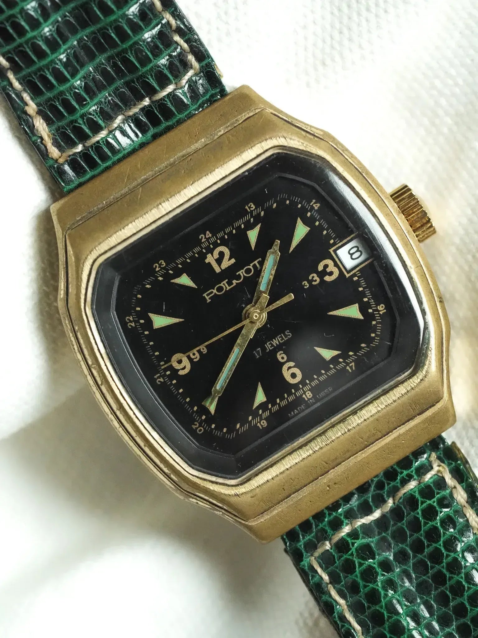 Vintage Poljot watch with gold case, black dial, green reptile strap