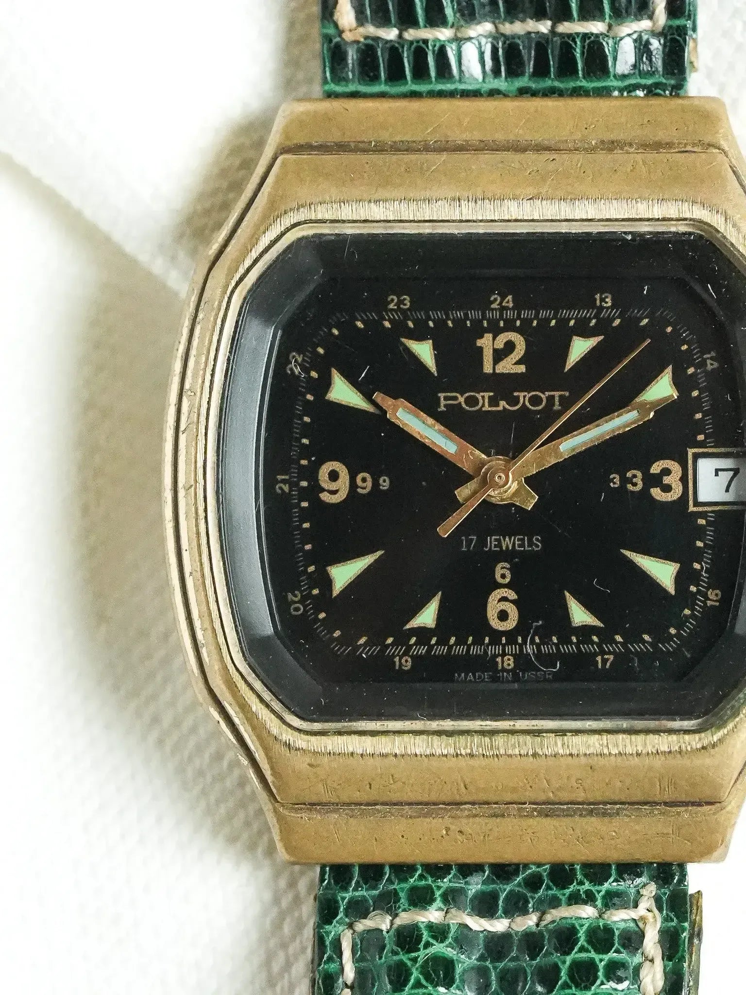 Vintage Poljot watch with black dial, gold case, green reptile strap, 24-hour display