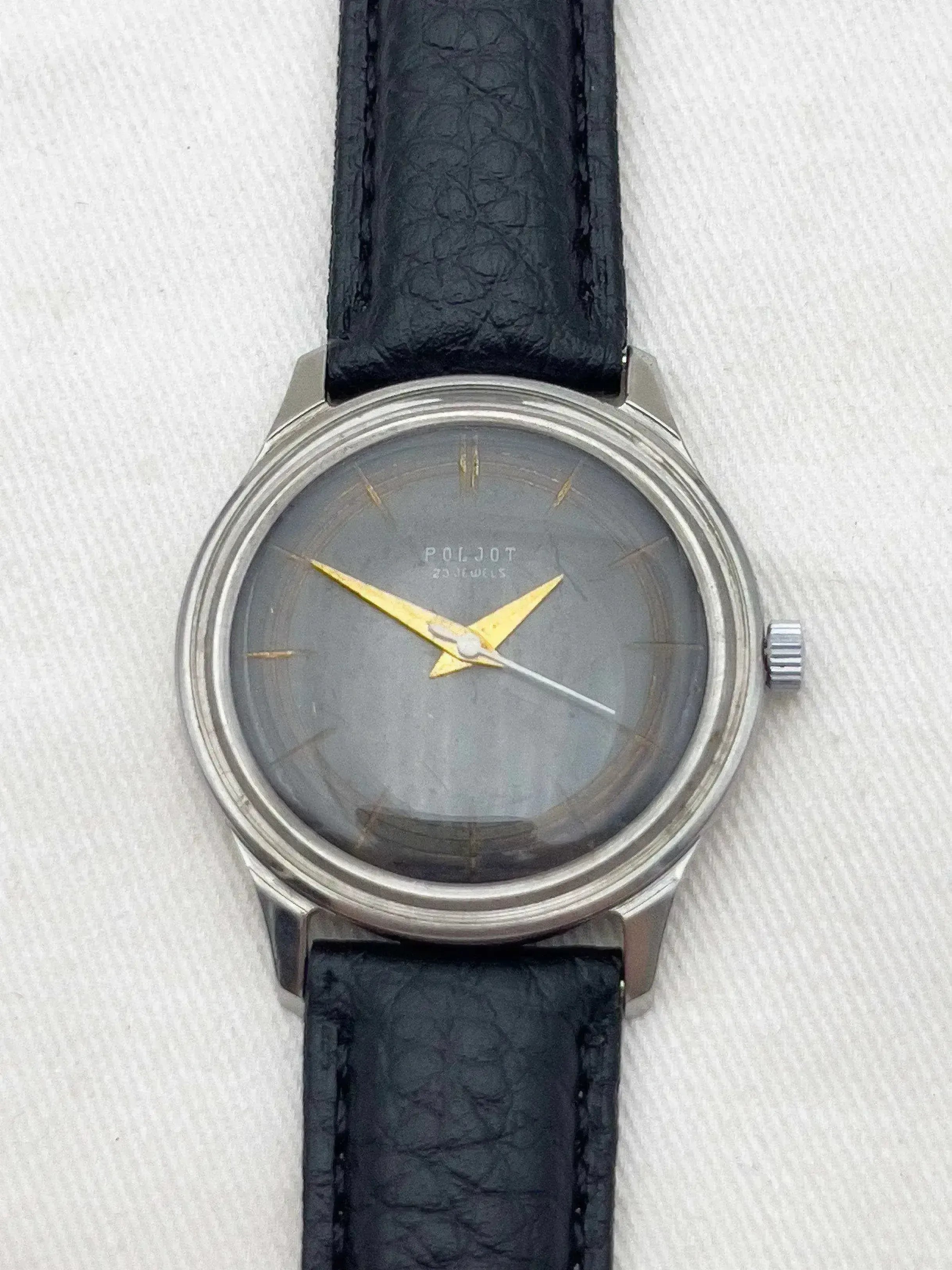 Poljot vintage watch with grey dial, gold hands, and black leather strap