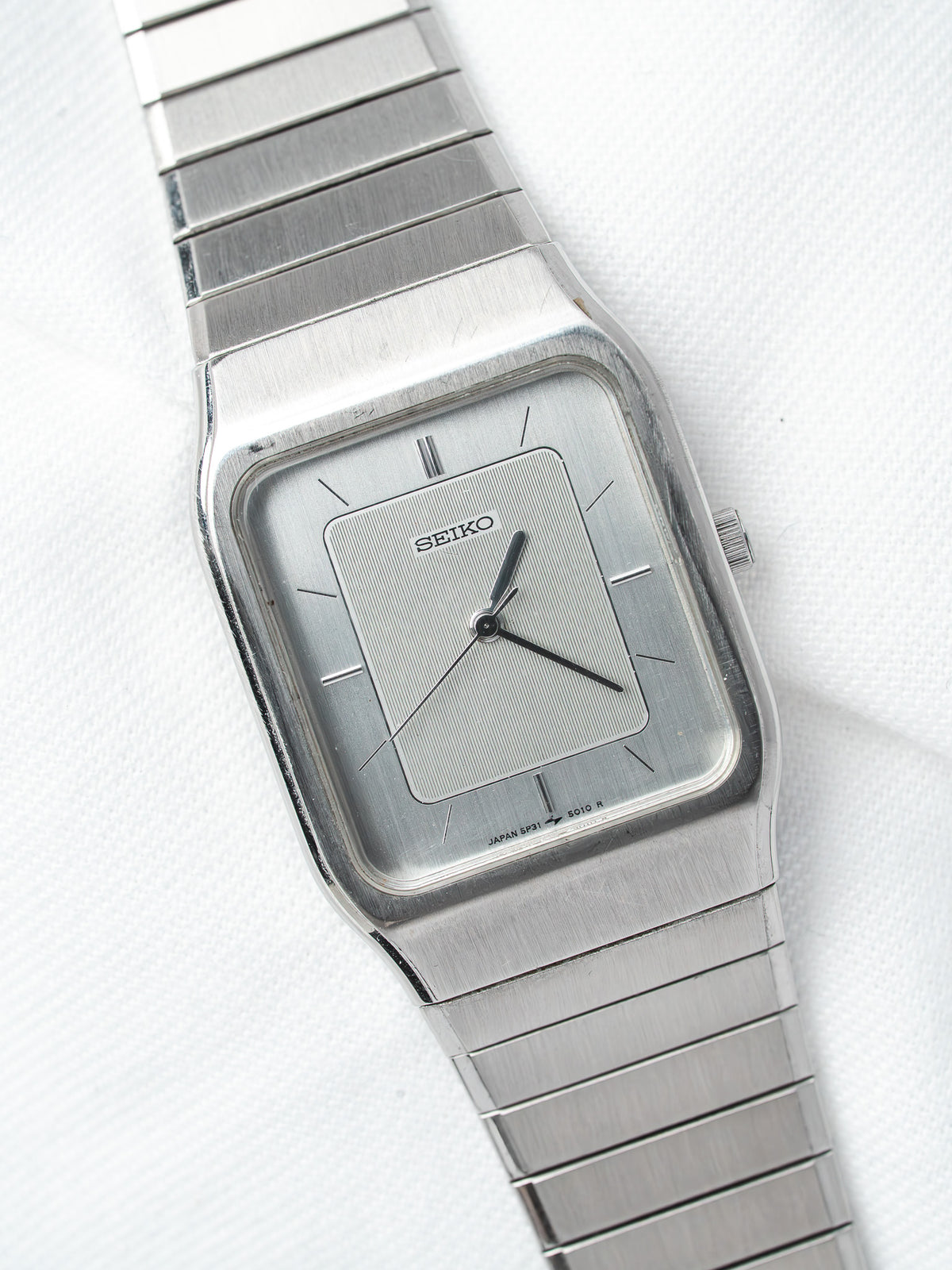 Seiko vintage watch with square silver dial and metal bracelet