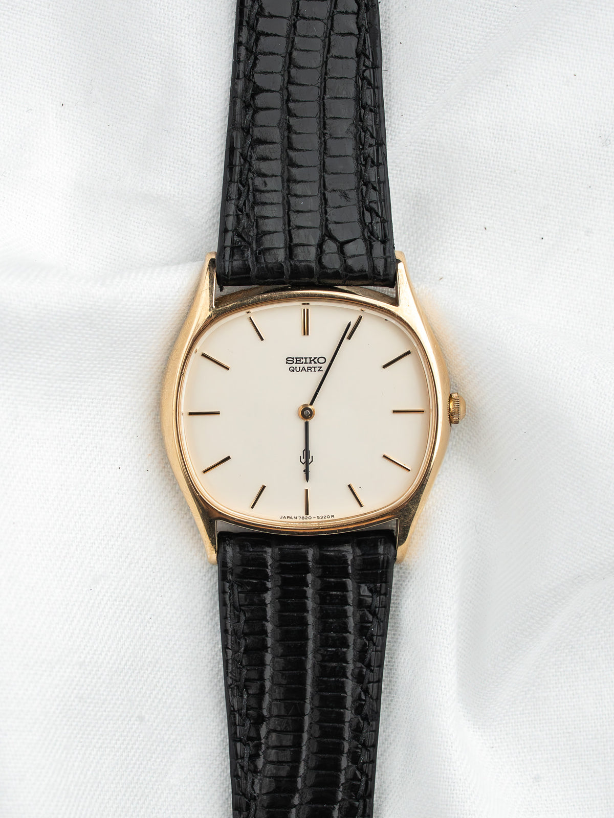 Seiko Quartz vintage watch with gold case, cream dial, black textured strap