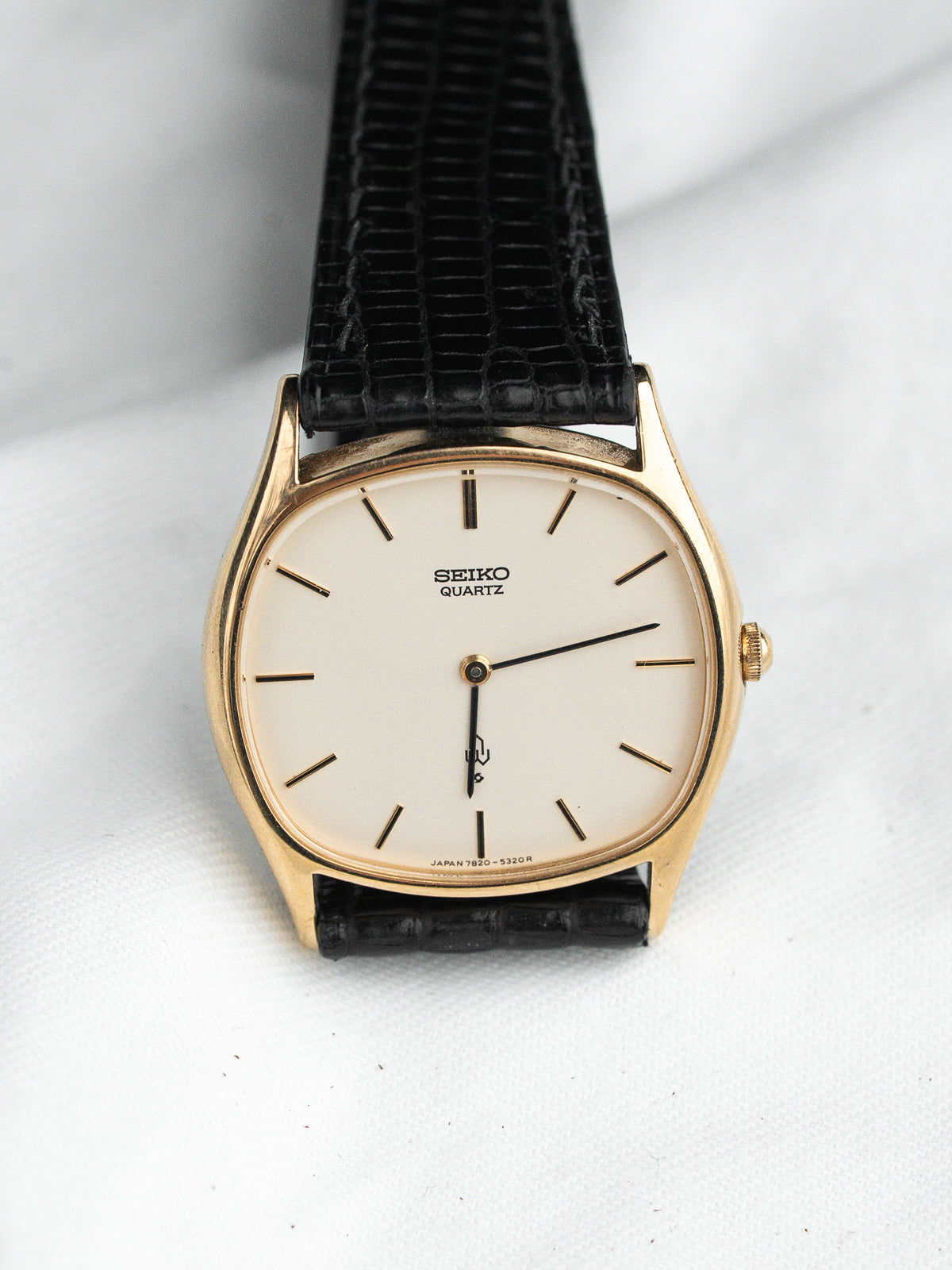 Seiko Quartz vintage watch with gold case, cream dial, black leather strap