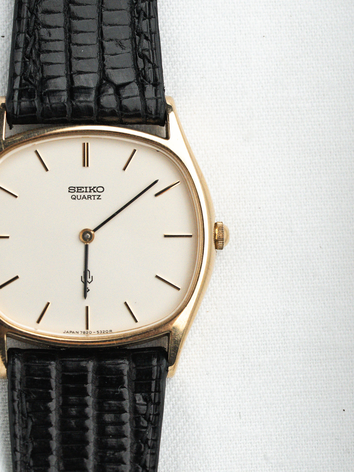 Seiko Quartz vintage watch with gold case, white dial, black alligator strap