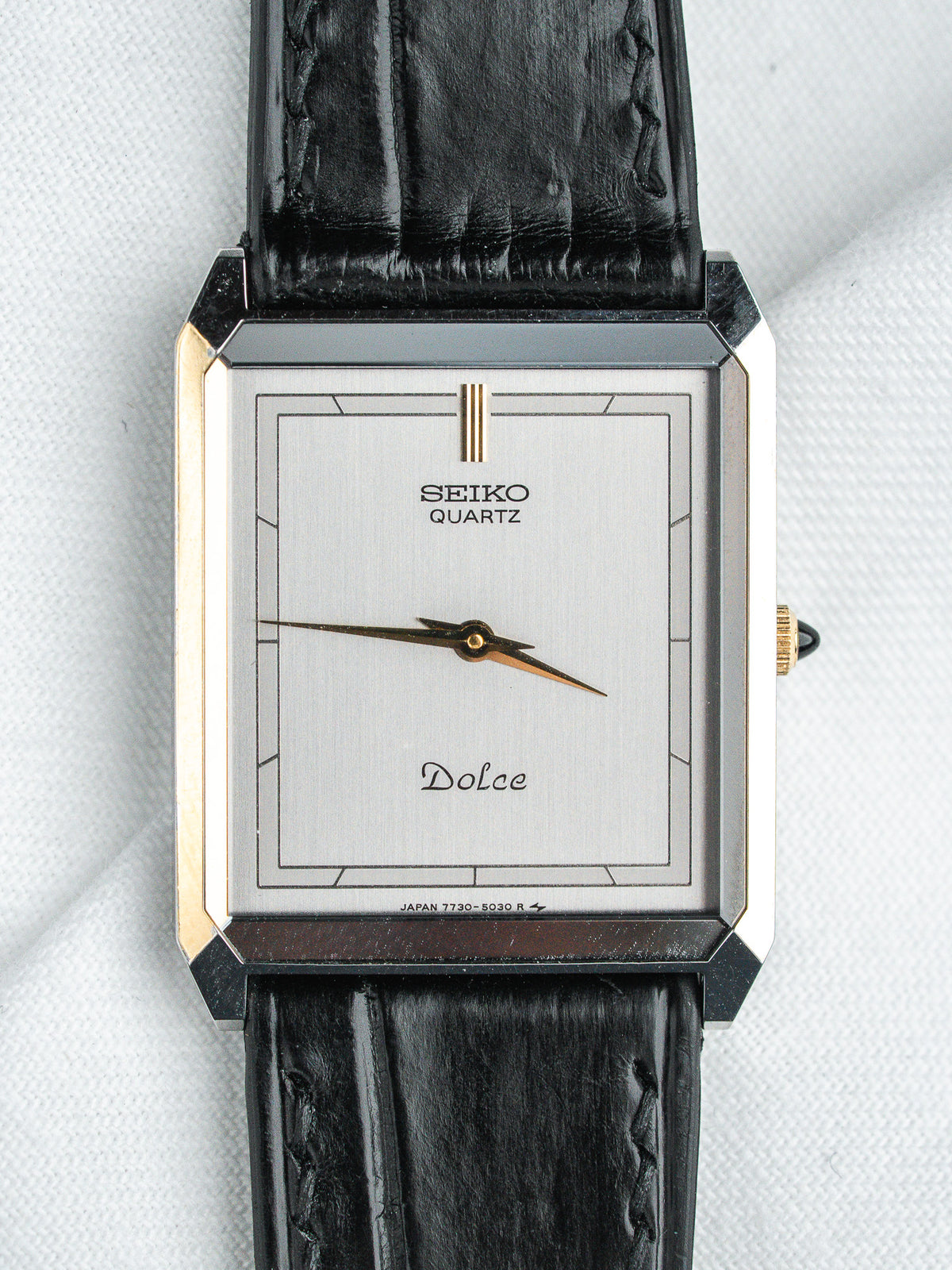 Seiko Dolce vintage quartz watch with silver dial and black leather strap