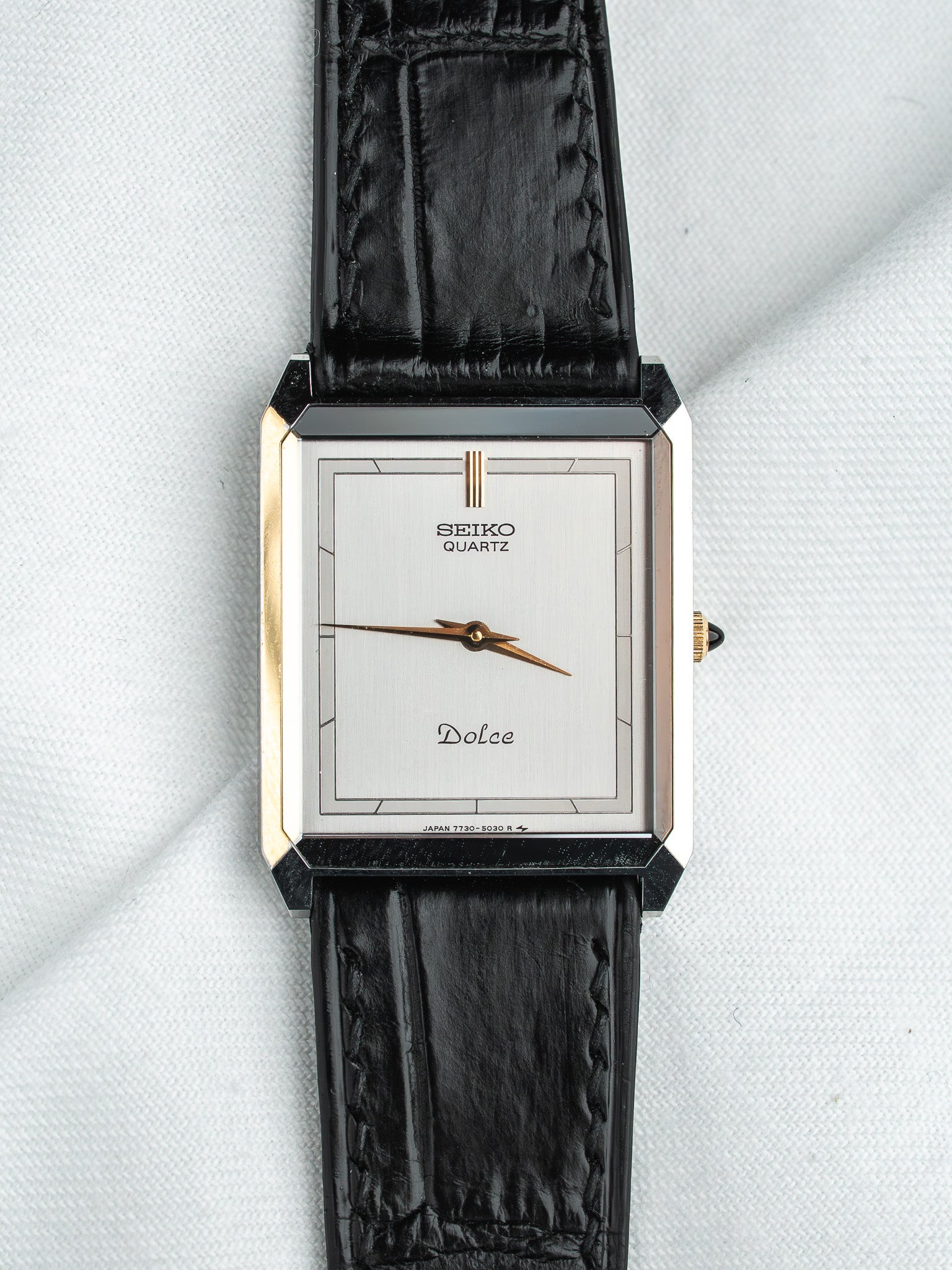 Seiko Quartz Dolce vintage watch with silver dial and black leather strap