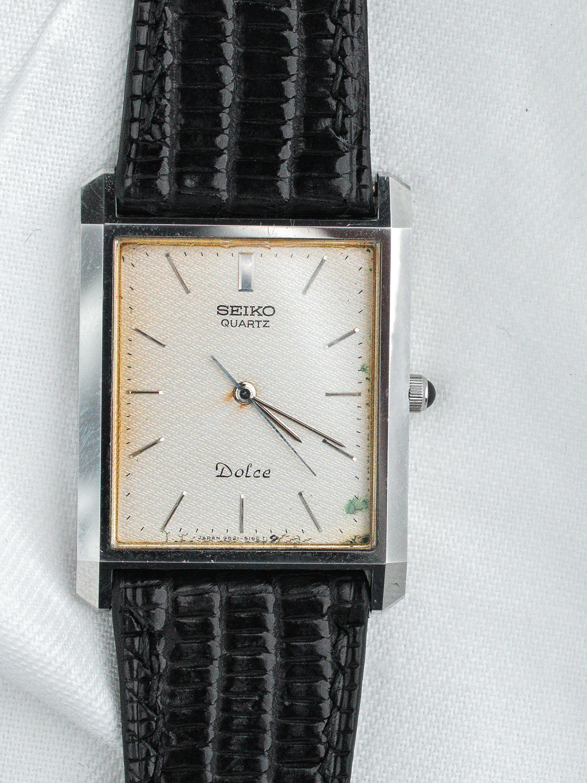 Seiko Dolce vintage quartz watch with silver dial, black alligator strap, rectangular case