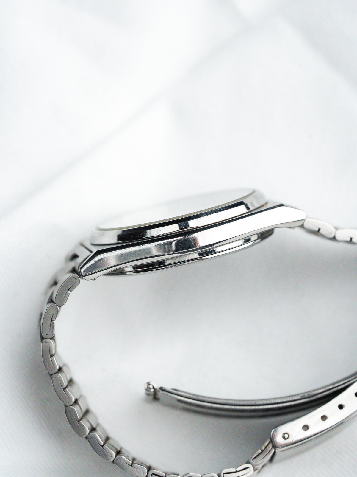 Vintage Omega watch with stainless steel bracelet and polished case side
