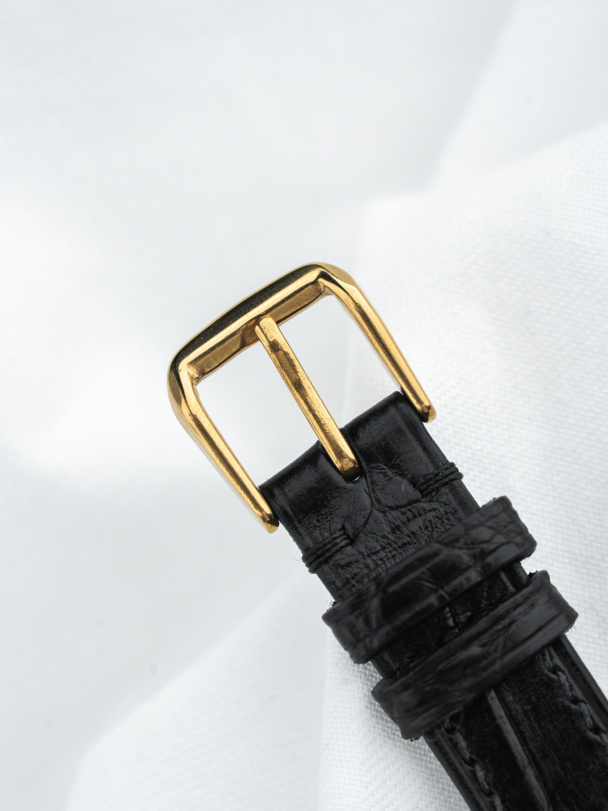 Black alligator strap with gold buckle, vintage luxury watch accessory