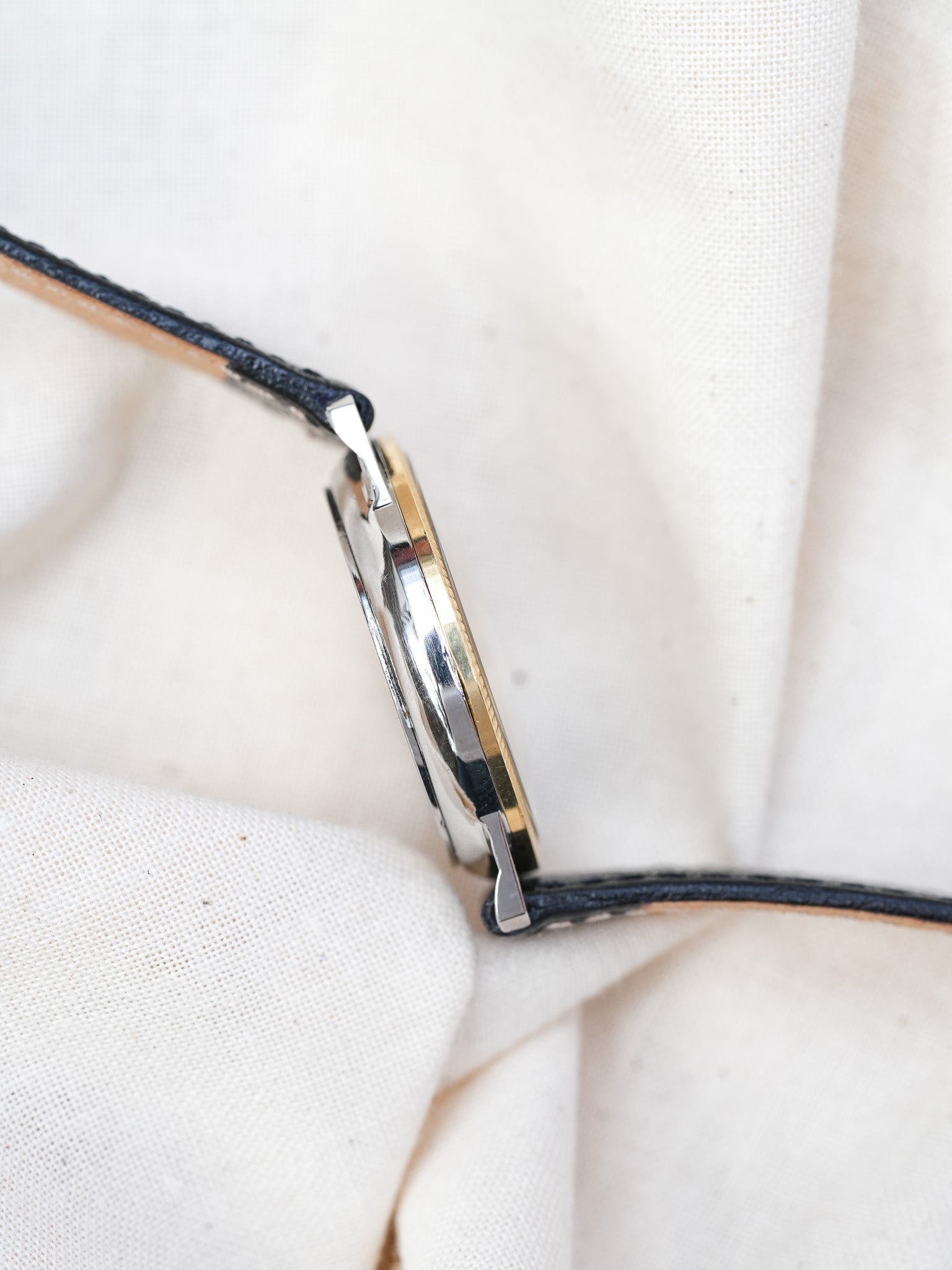 Universal Genève - Triple Calendar Phase de lune acier lunette guillochée or 18k - 1990s - Atelier Victor - Vintage Shop