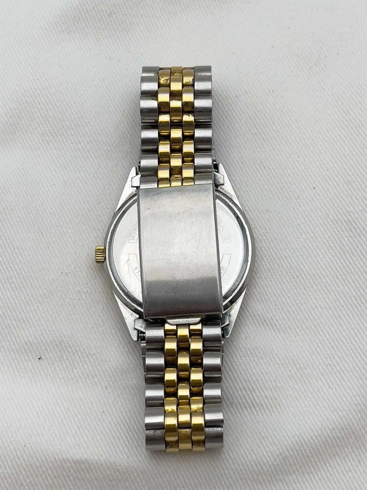 Vintage Omega Constellation watch with two-tone steel and gold bracelet, case back view