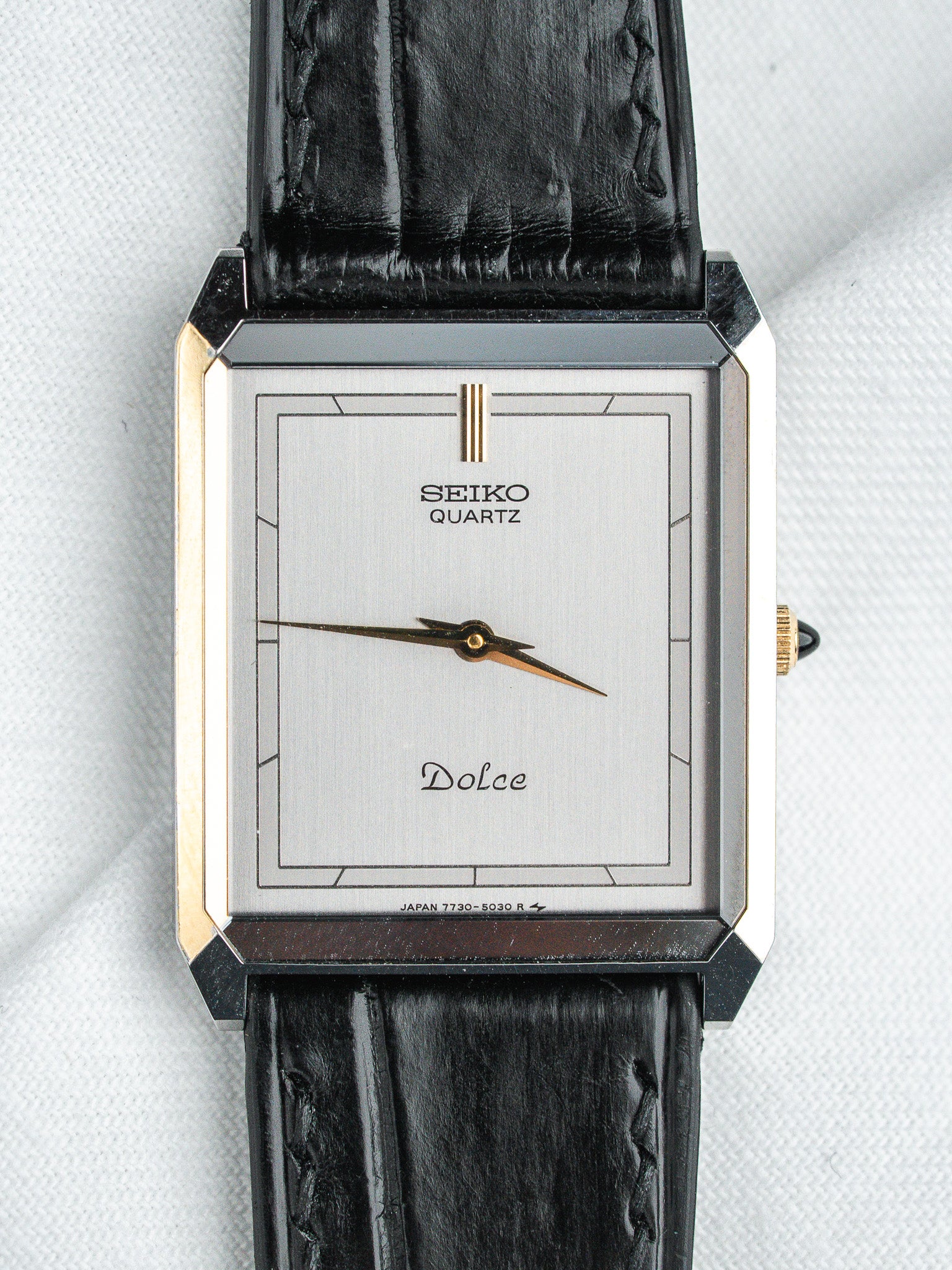 Seiko Dolce vintage quartz watch with silver dial and black leather strap
