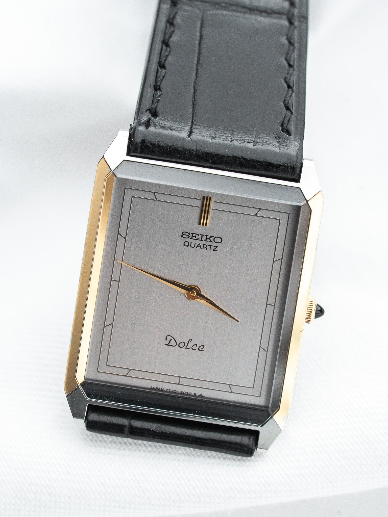 Seiko Dolce vintage quartz watch with gold accents and black leather strap