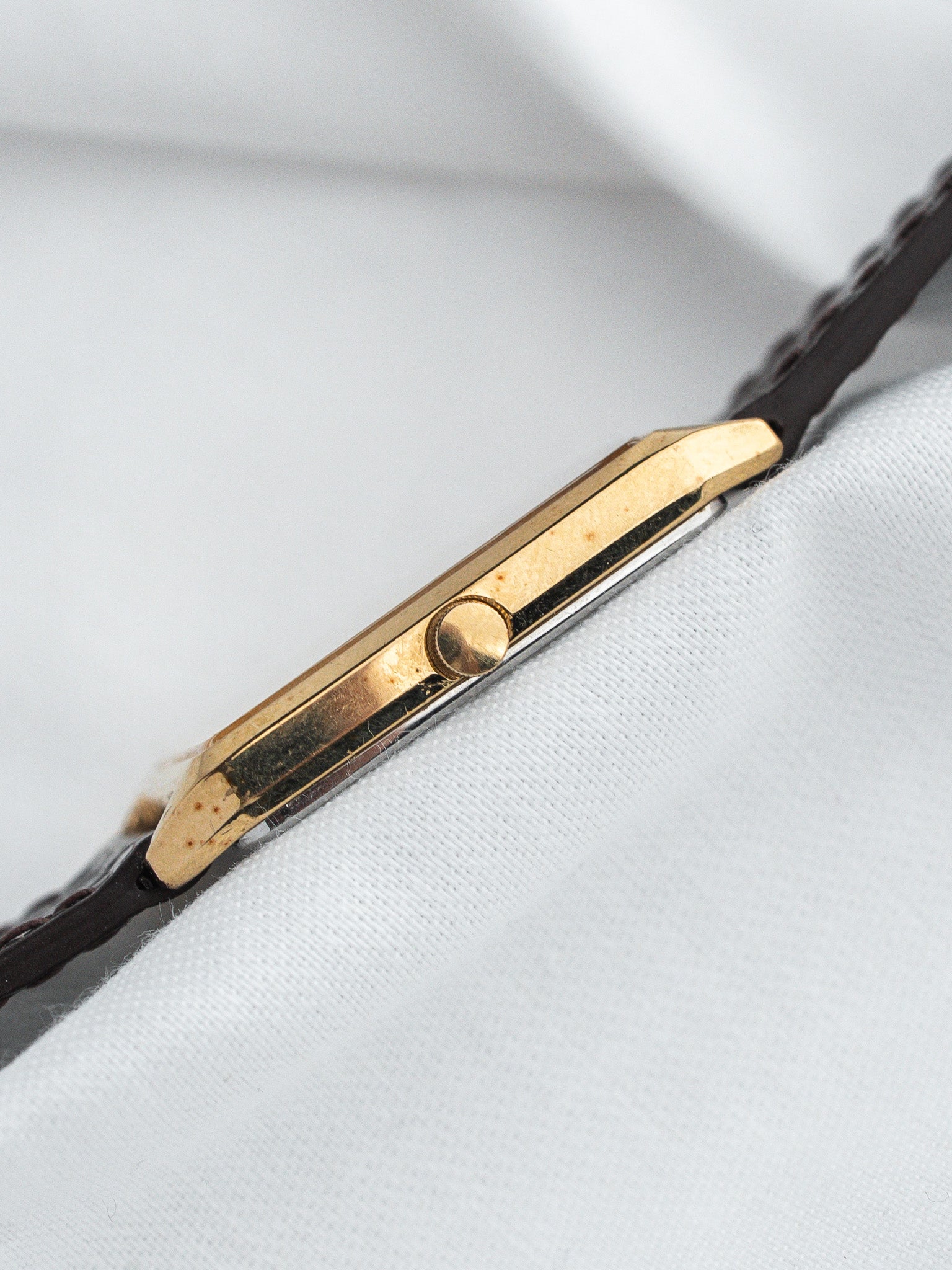 Vintage Cartier Tank watch with gold case and brown leather strap