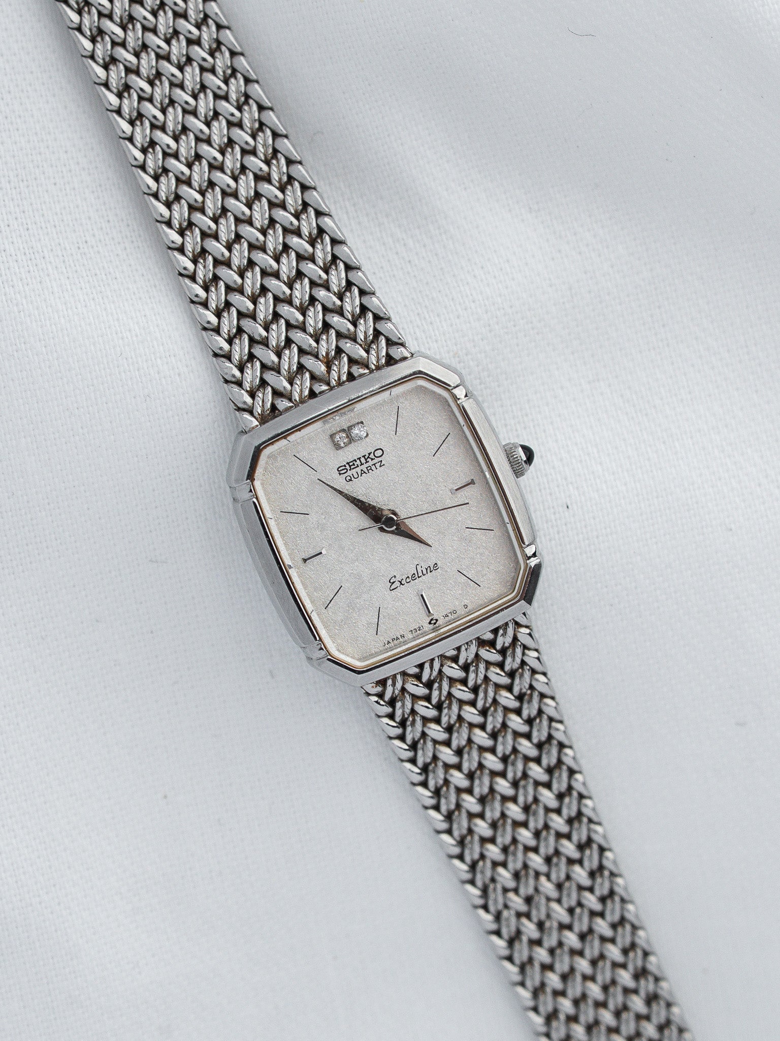 Seiko Exceline vintage quartz watch with silver dial and mesh bracelet