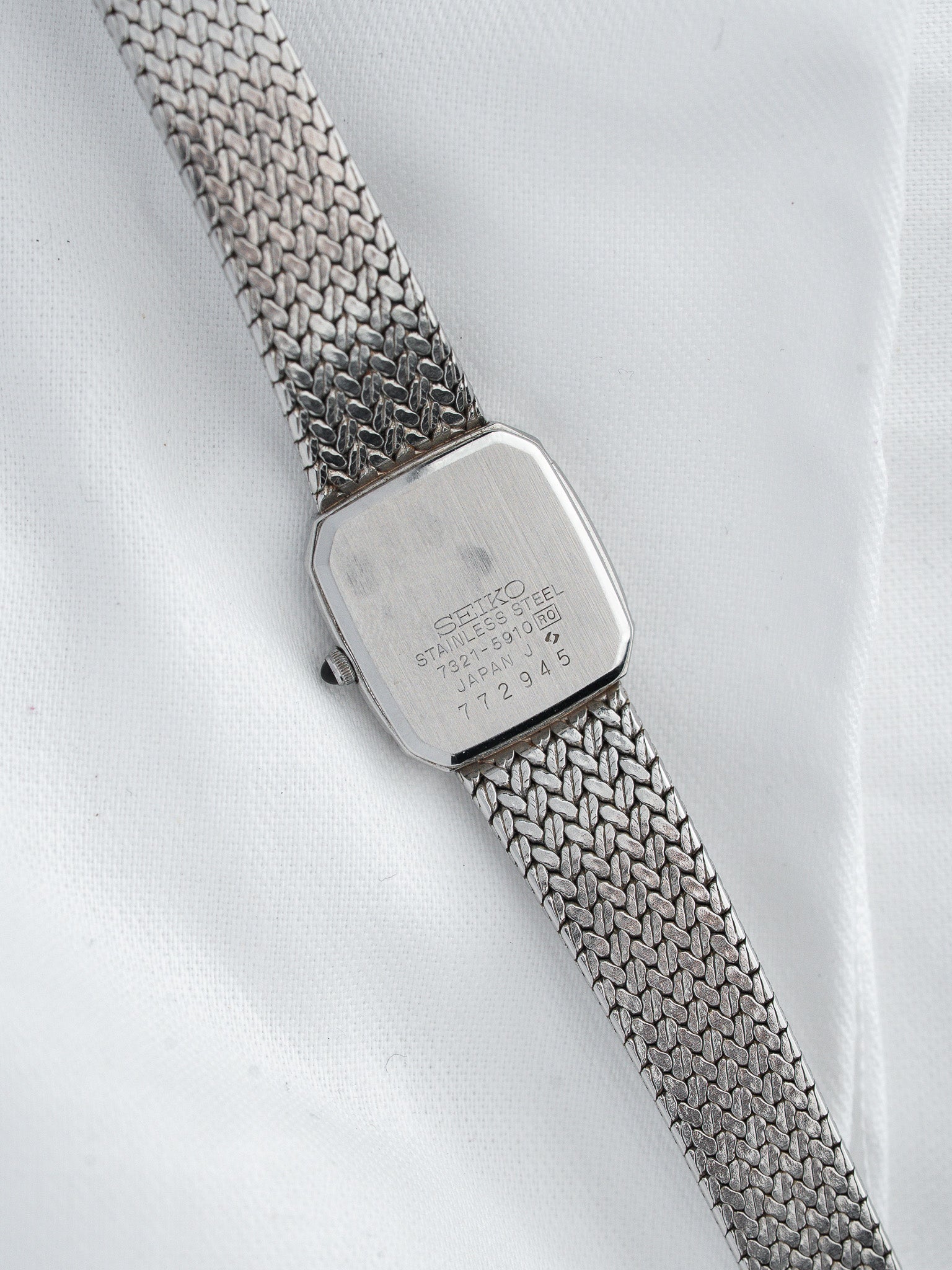 Seiko vintage watch with stainless steel mesh bracelet and engraved case back