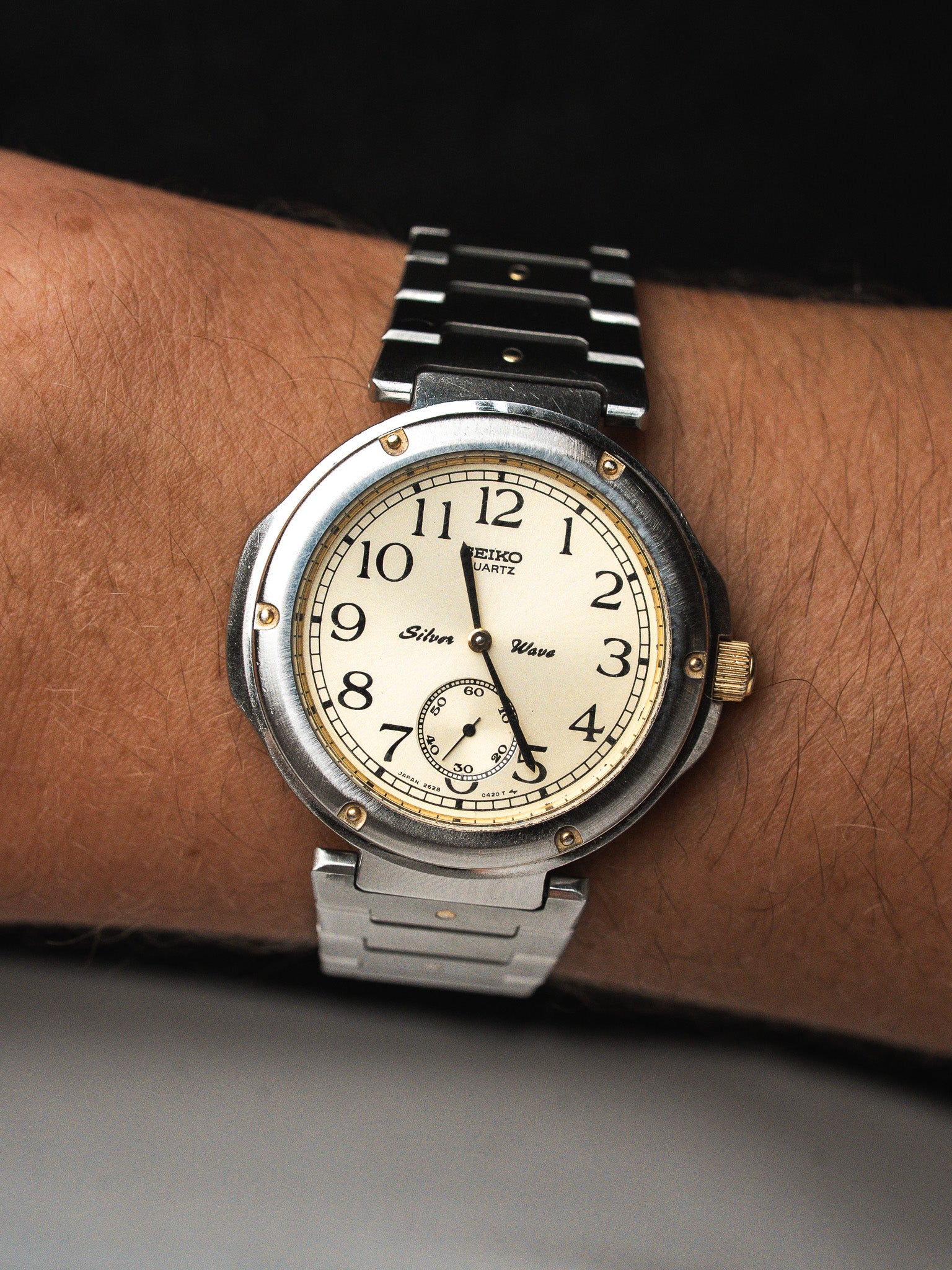 Seiko Silver Wave vintage watch with cream dial, steel bracelet, worn on wrist