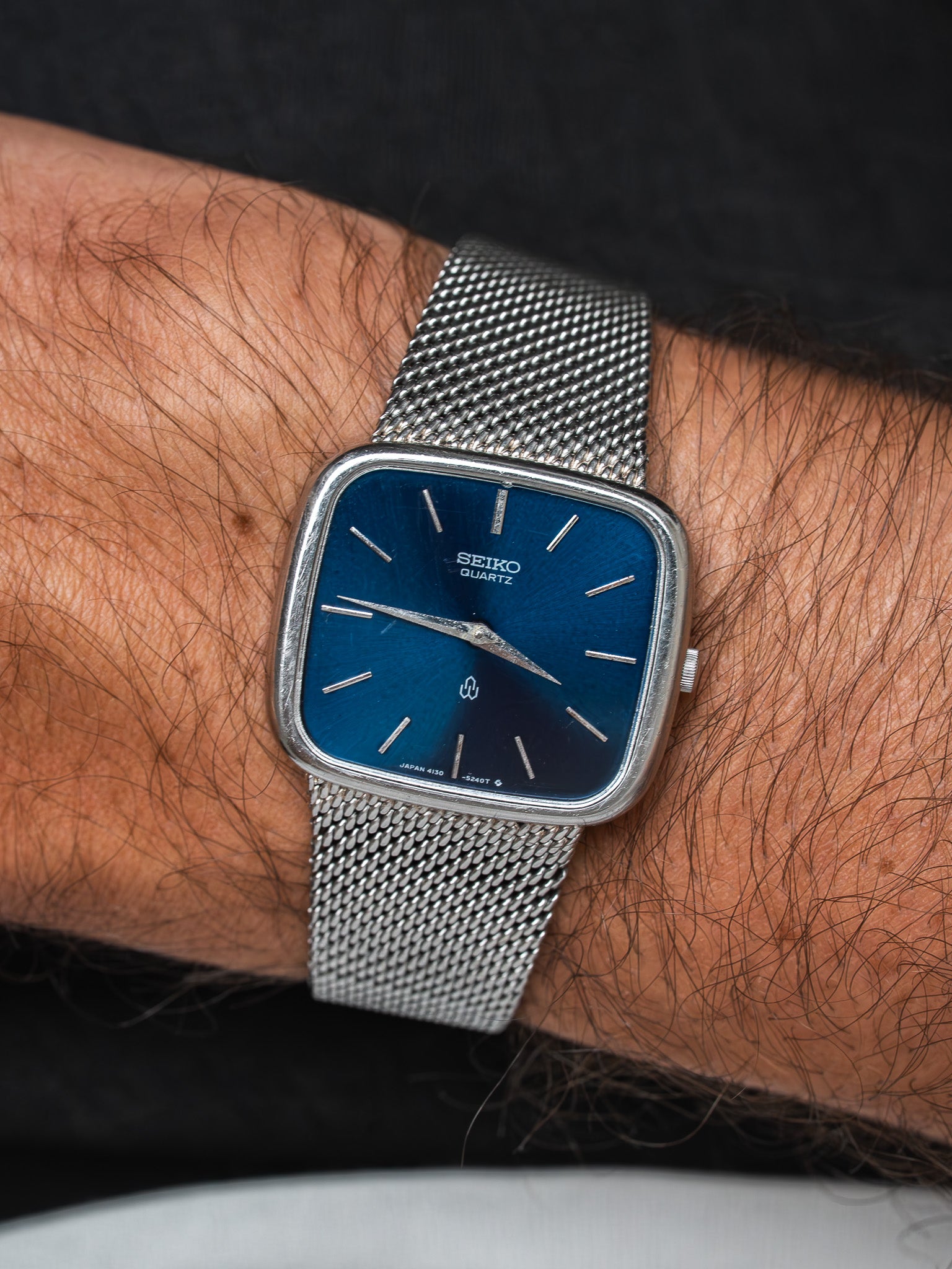 Seiko Quartz vintage watch with blue dial and mesh bracelet on wrist