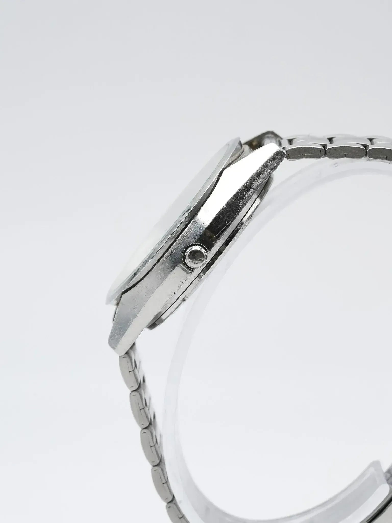 Vintage Omega watch side view, stainless steel case and bracelet, minimalist design