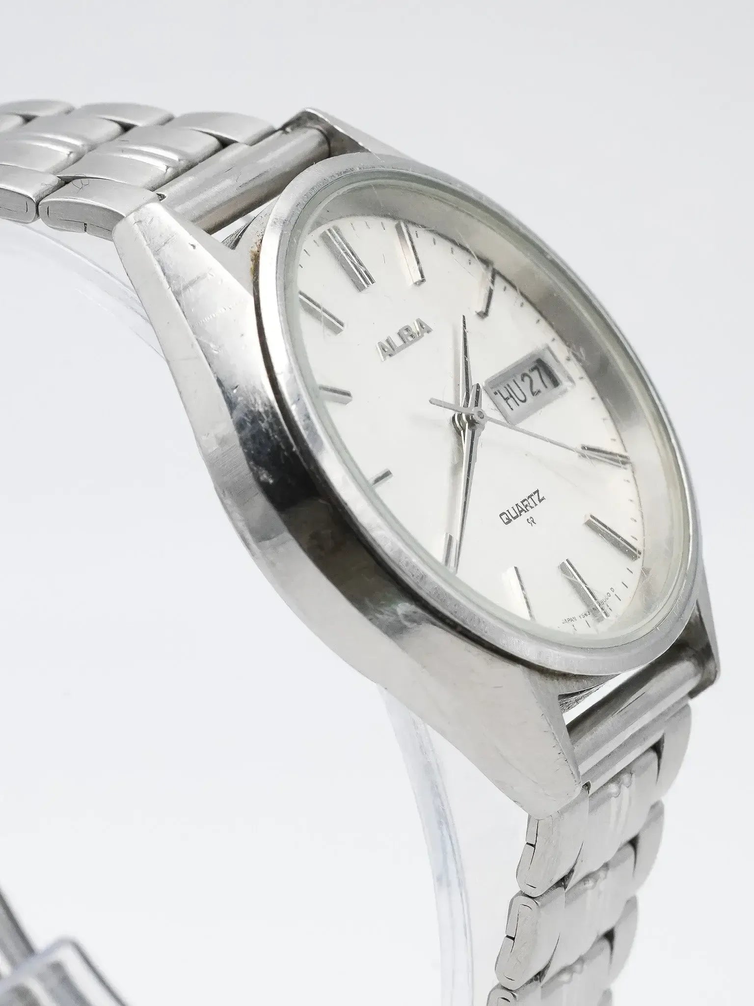 Alba vintage quartz watch with white dial, day date, and steel bracelet
