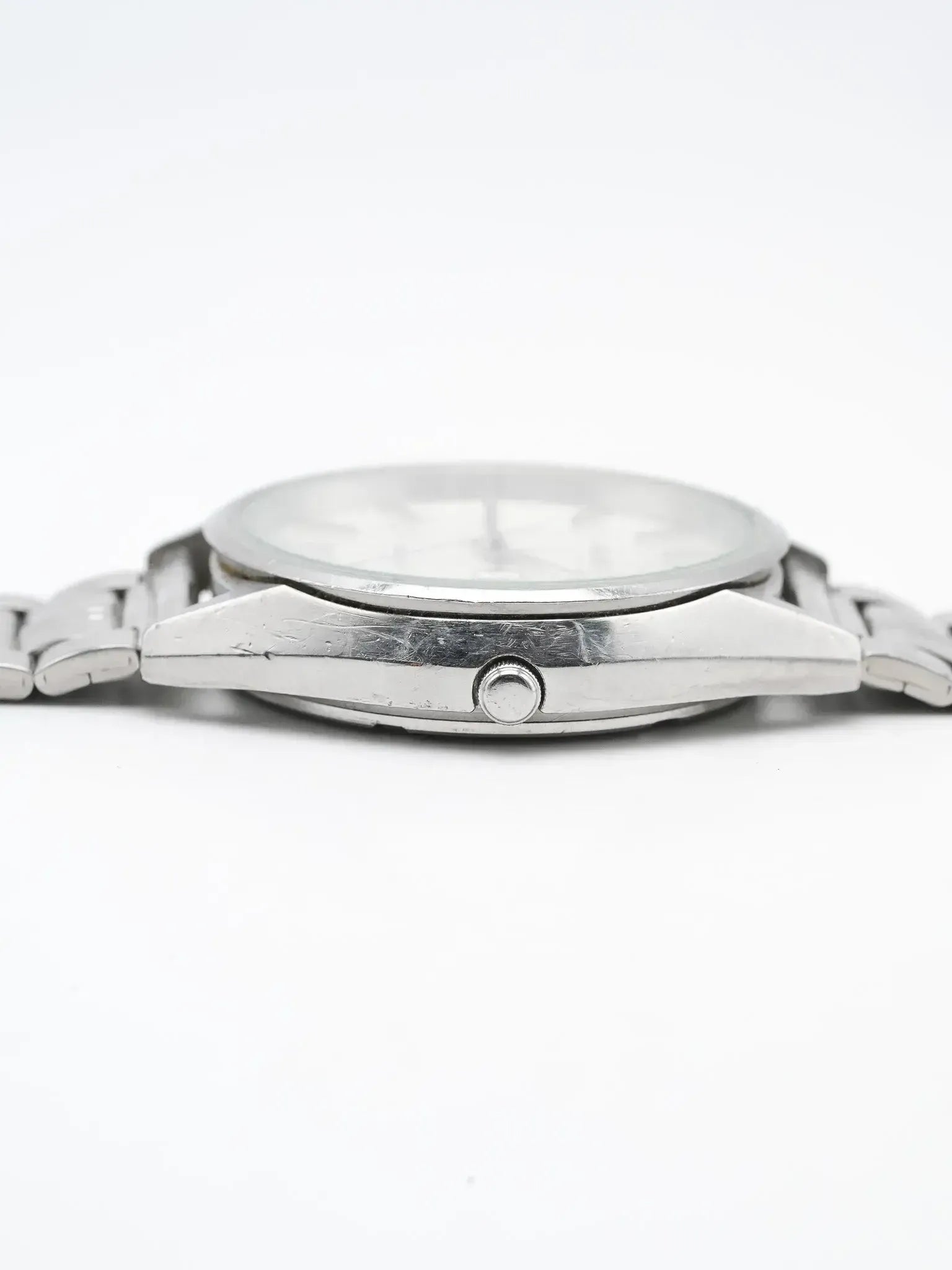 Vintage Omega watch with stainless steel case and bracelet, side profile view