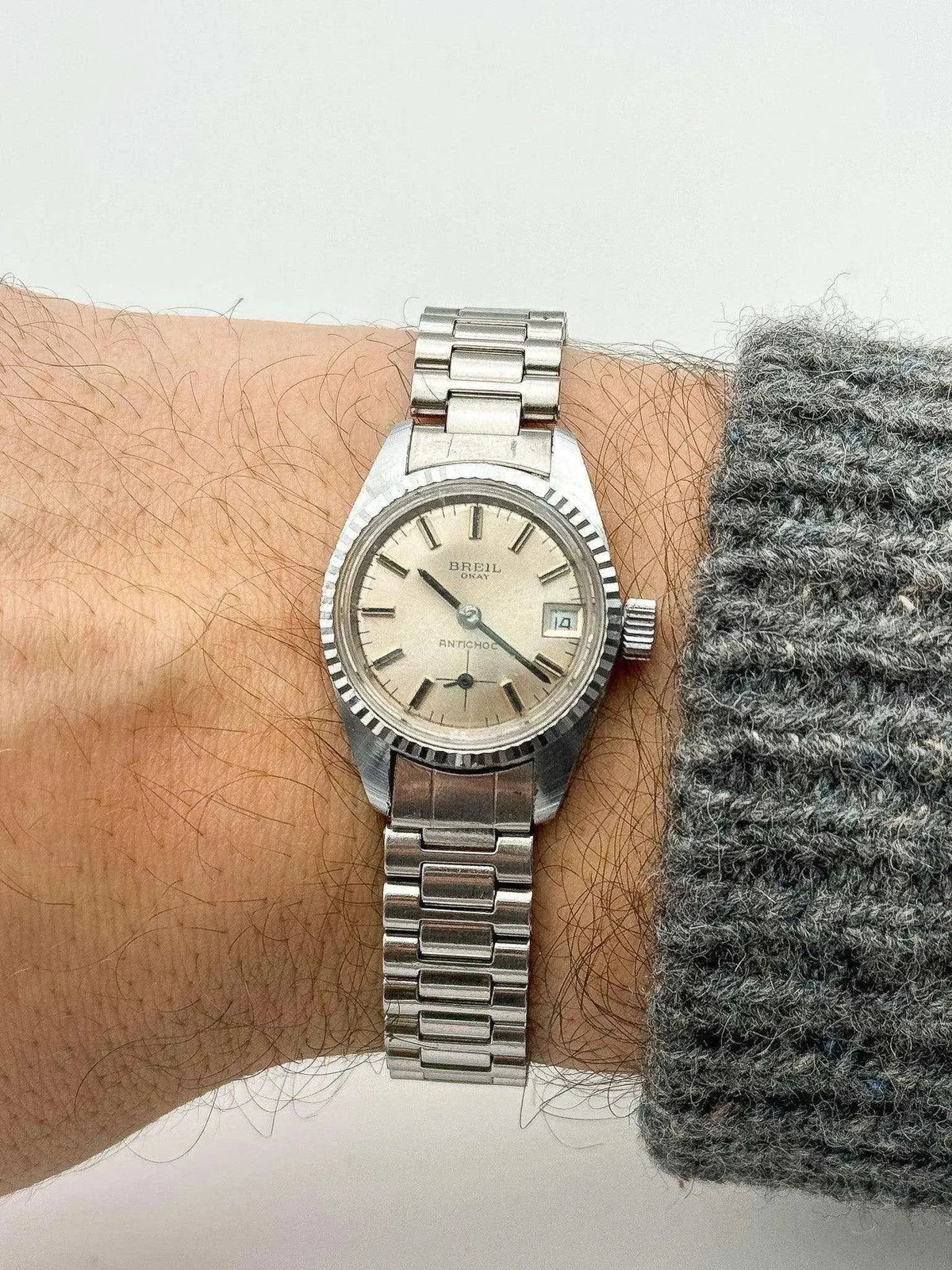 Breil O'Kay vintage watch with silver dial, steel bracelet, worn on wrist