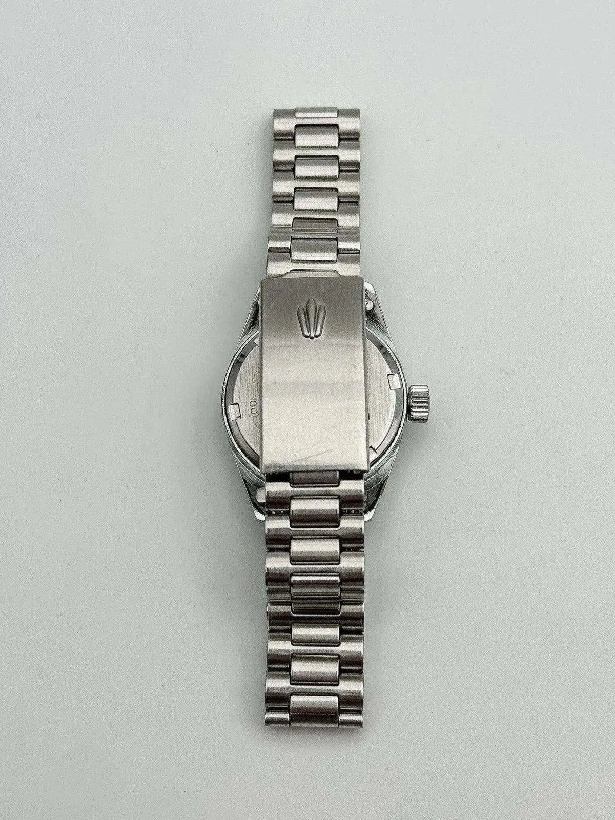 Rolex vintage watch back view, stainless steel case and bracelet, crown visible