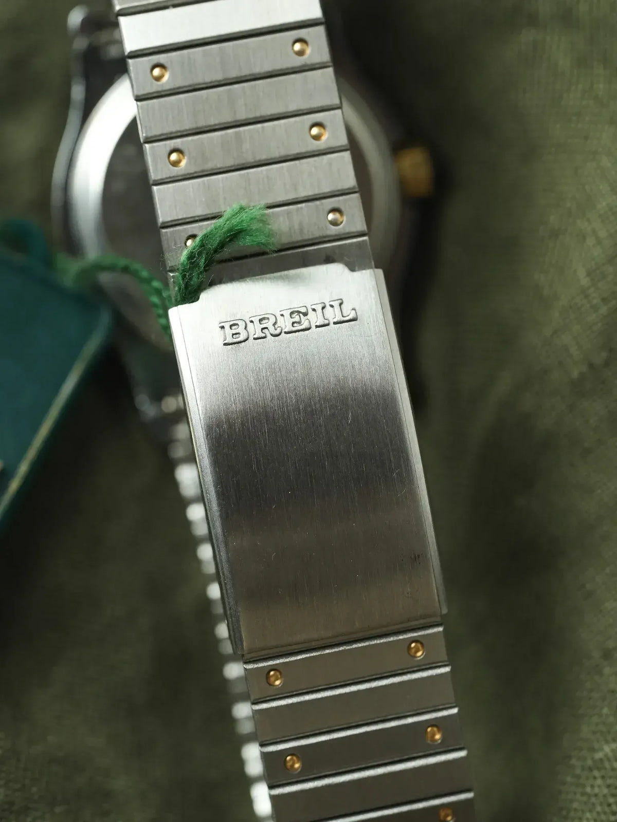 Breil vintage watch bracelet with brushed steel links and gold pins, green tag attached