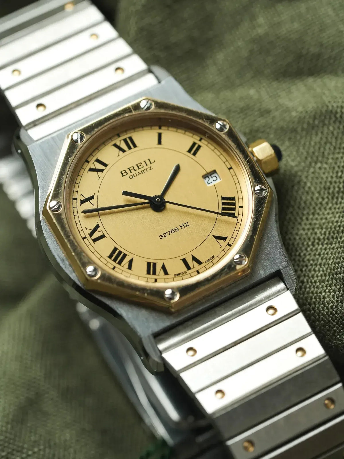 Breil Quartz vintage watch with gold dial, Roman numerals, and two-tone bracelet