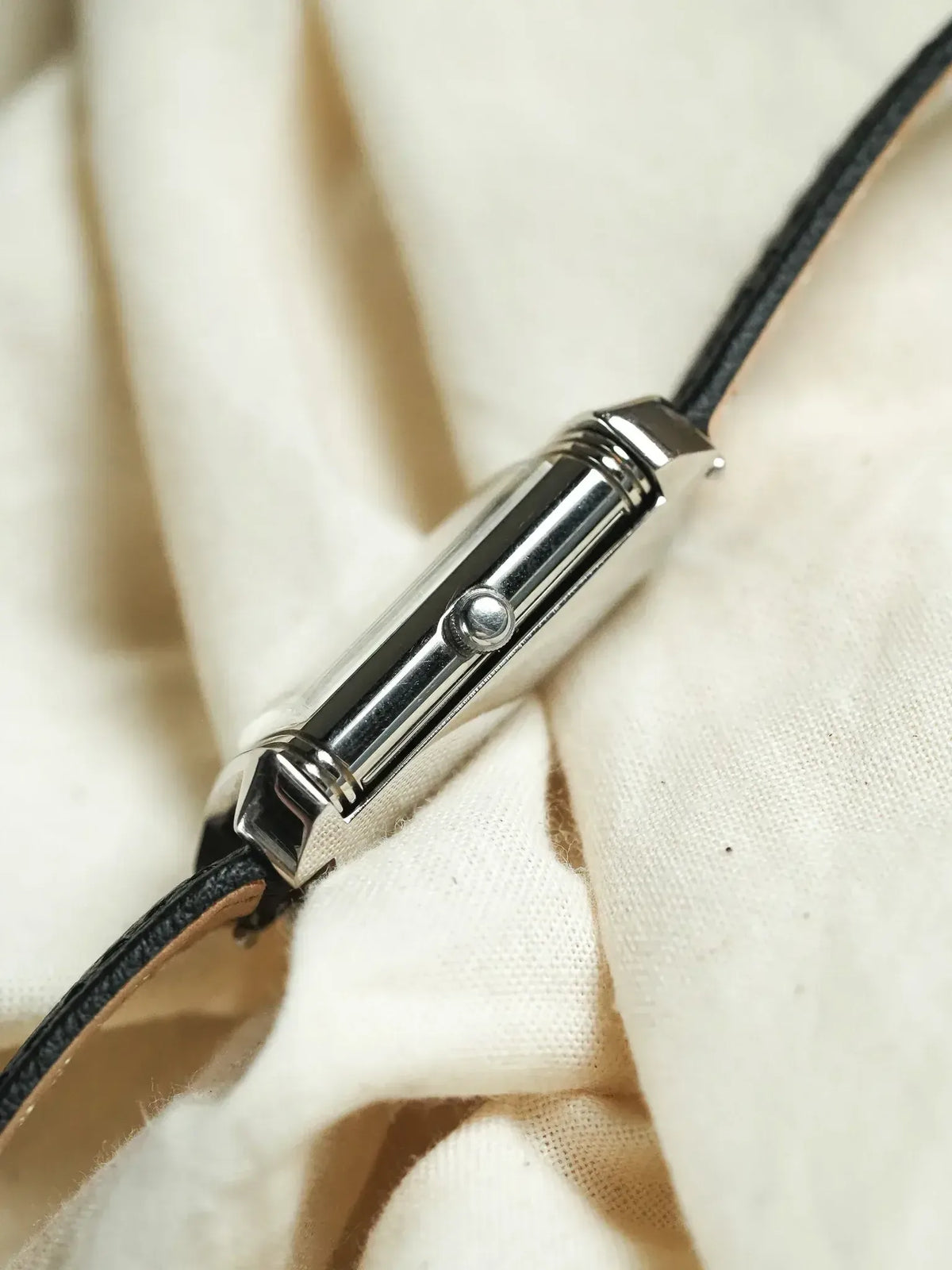 Cartier Tank vintage watch with polished steel case and black leather strap