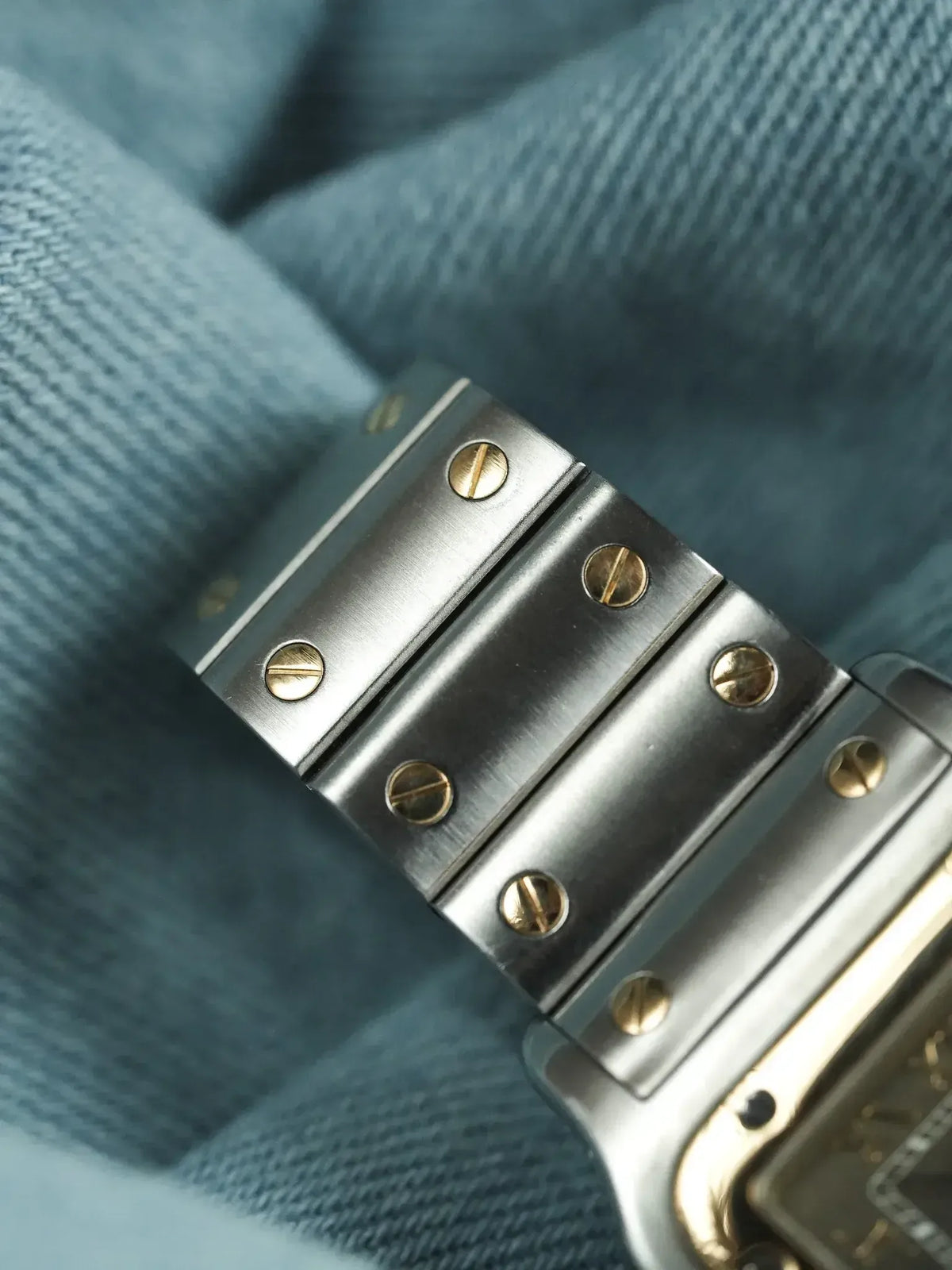 Cartier Santos vintage bracelet with brushed steel links and gold screws