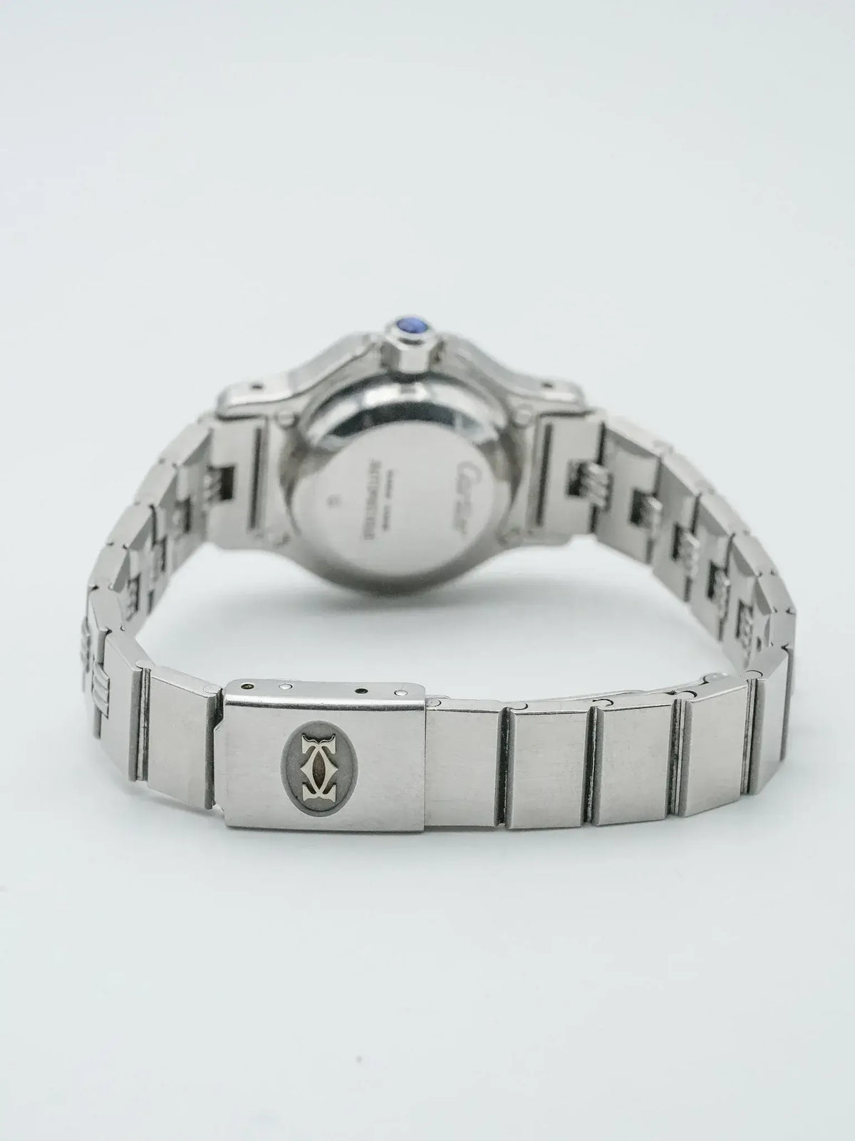 Cartier Pasha watch back view, stainless steel case, blue cabochon crown, bracelet clasp logo